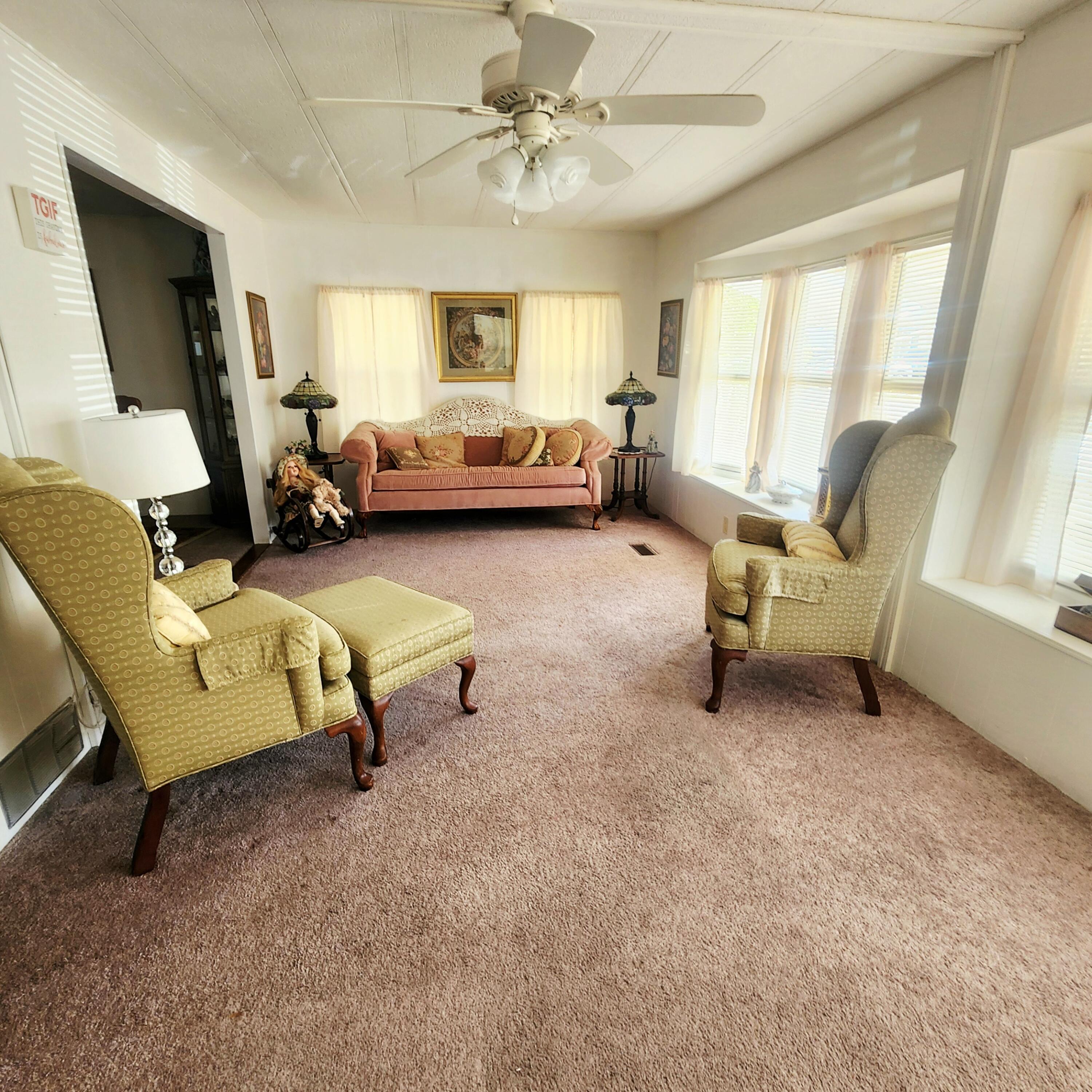 98 Camino Del Rio Port St. Lucie, FL 34952 - Photo 12 of 60 a bedroom with furniture and a window