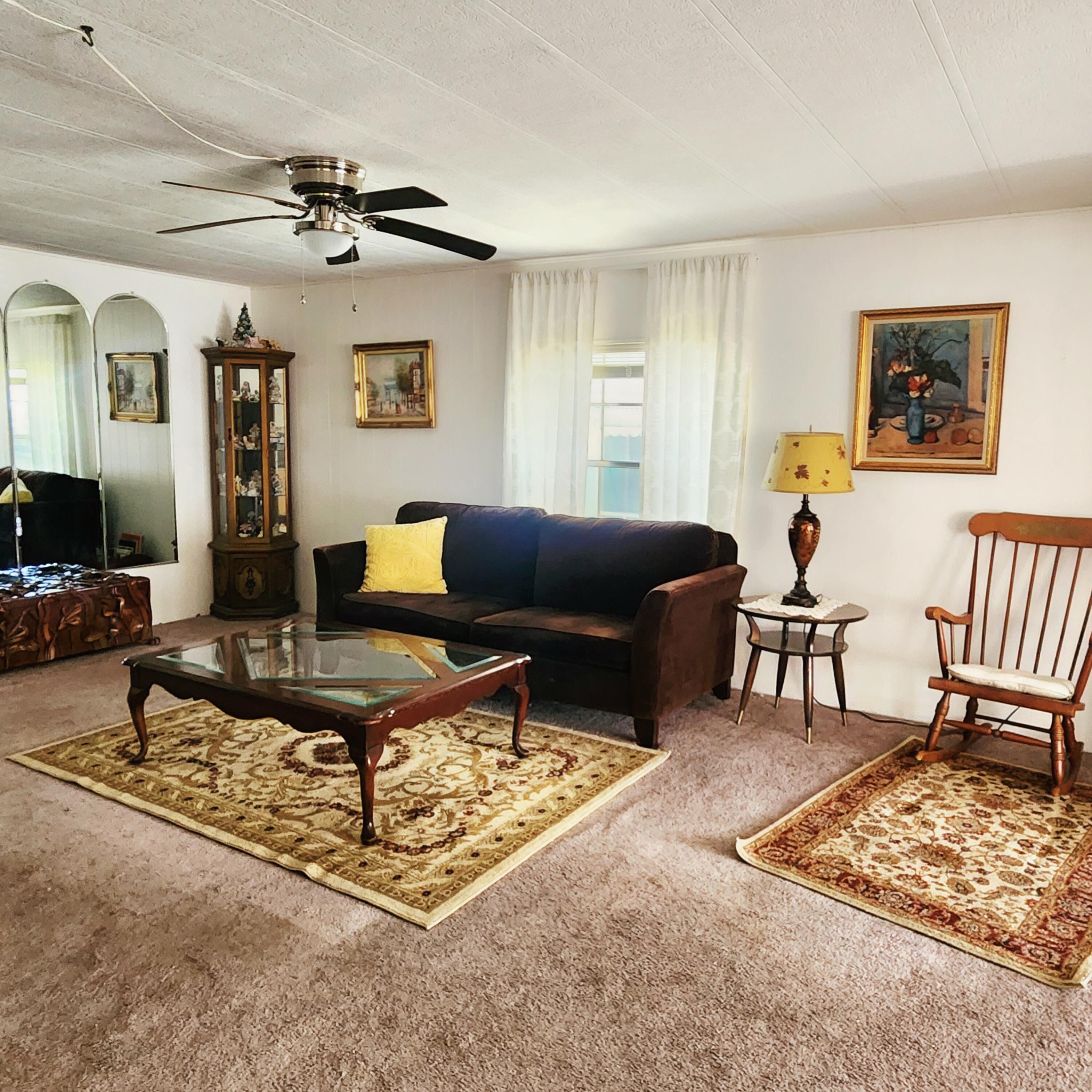 98 Camino Del Rio Port St. Lucie, FL 34952 - Photo 13 of 60 a living room with furniture and a rug