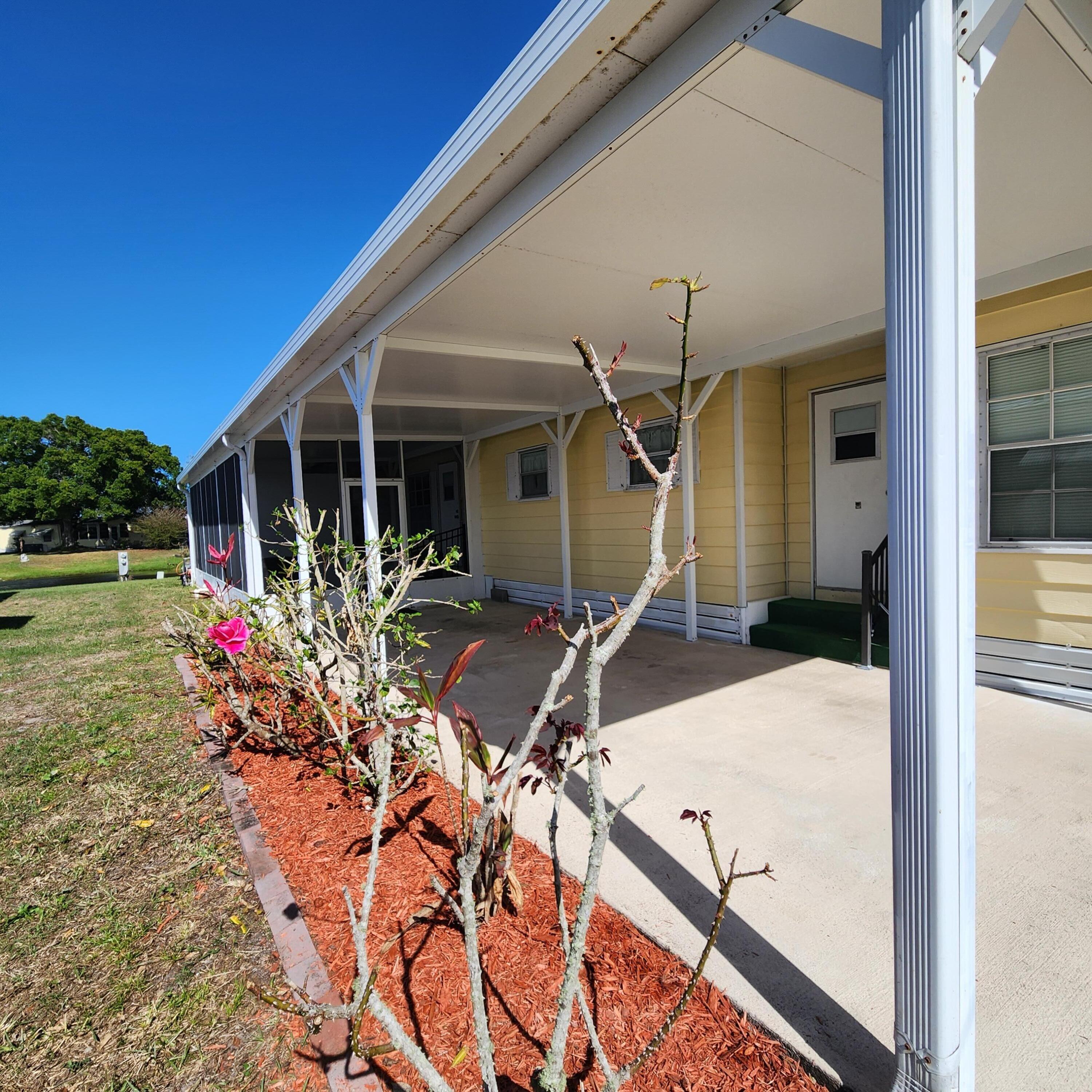 98 Camino Del Rio Port St. Lucie, FL 34952 - Photo 4 of 60 a view of a house with patio