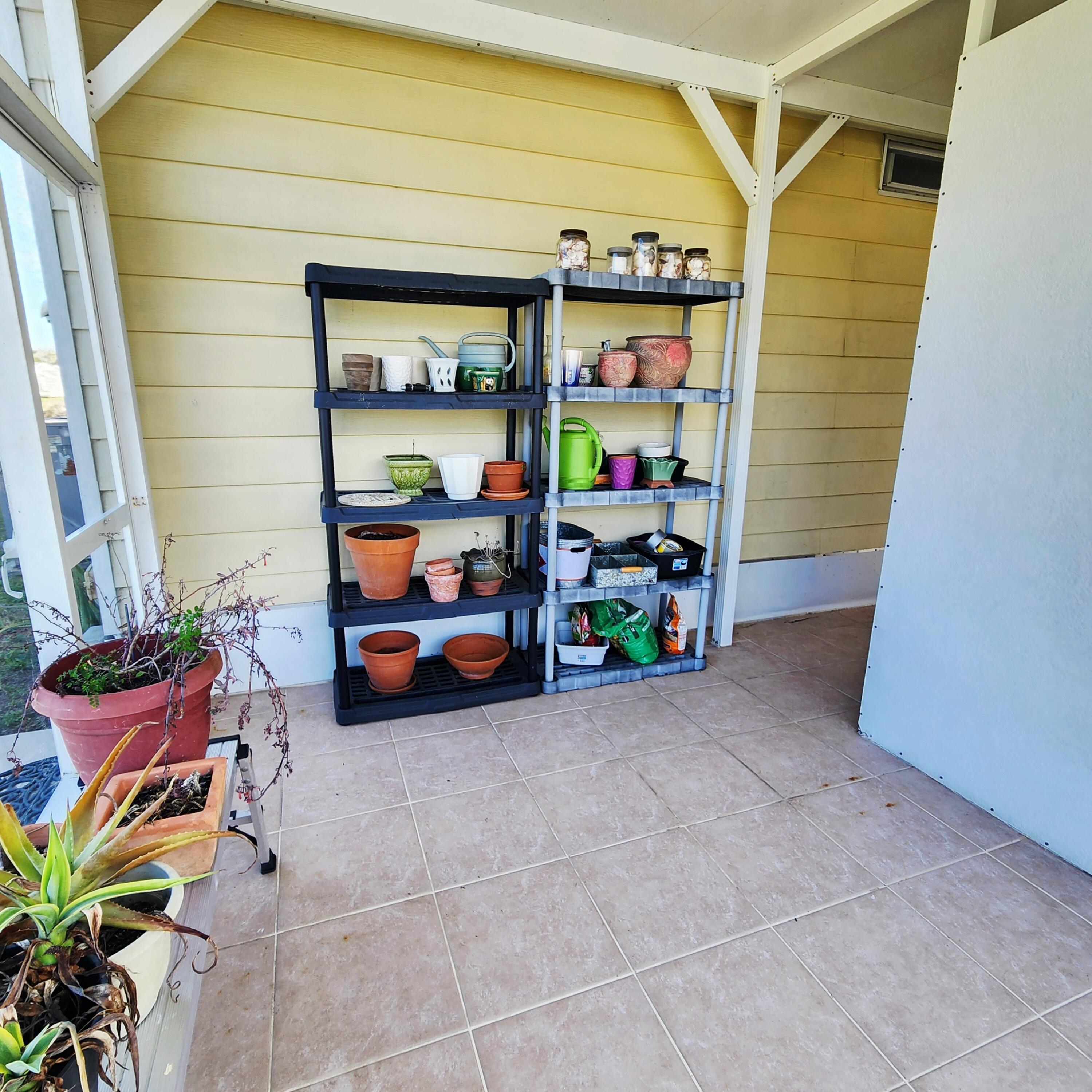 98 Camino Del Rio Port St. Lucie, FL 34952 - Photo 43 of 60 a backyard of a house with seating space