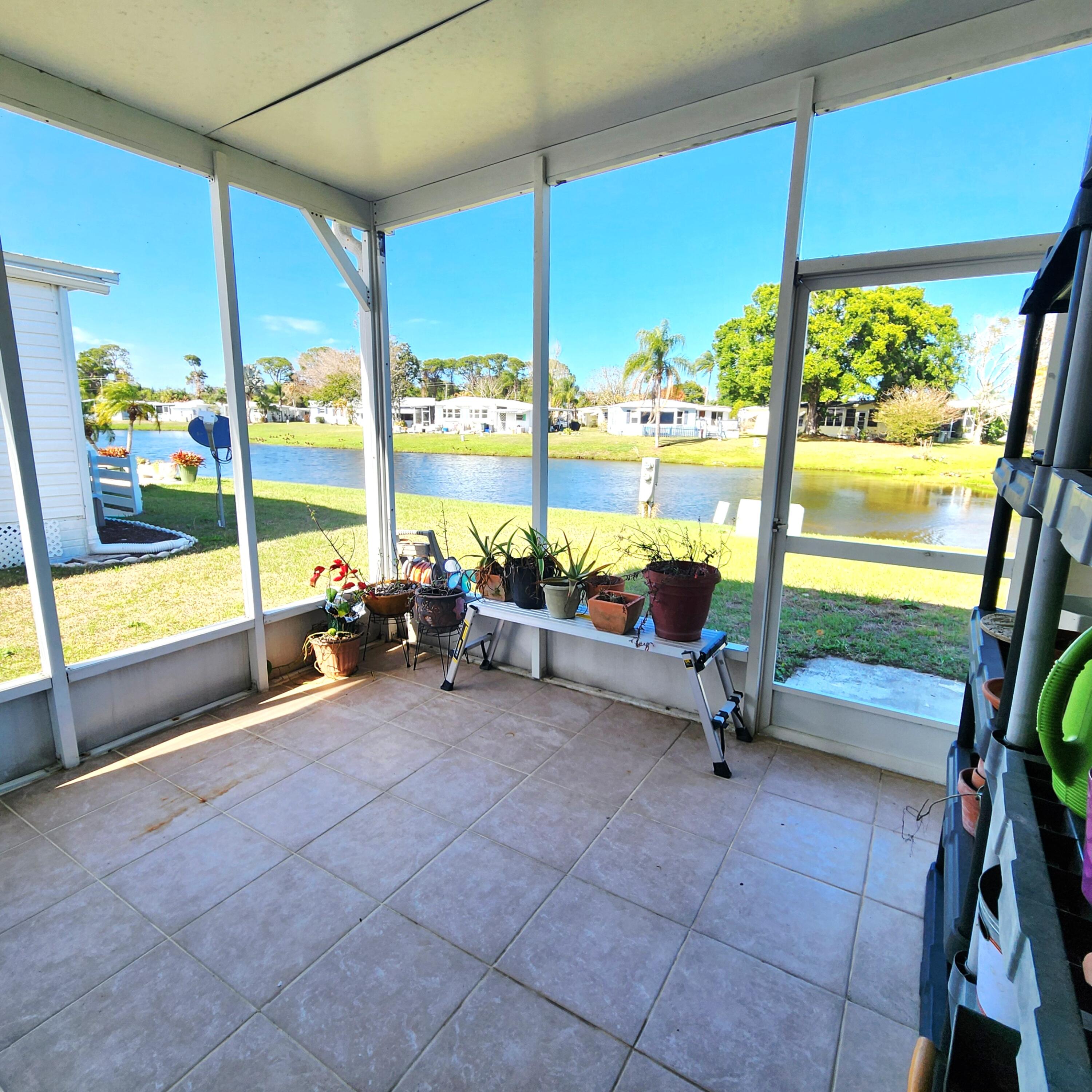 98 Camino Del Rio Port St. Lucie, FL 34952 - Photo 44 of 60 a view of a room with gym equipment and floor to ceiling window