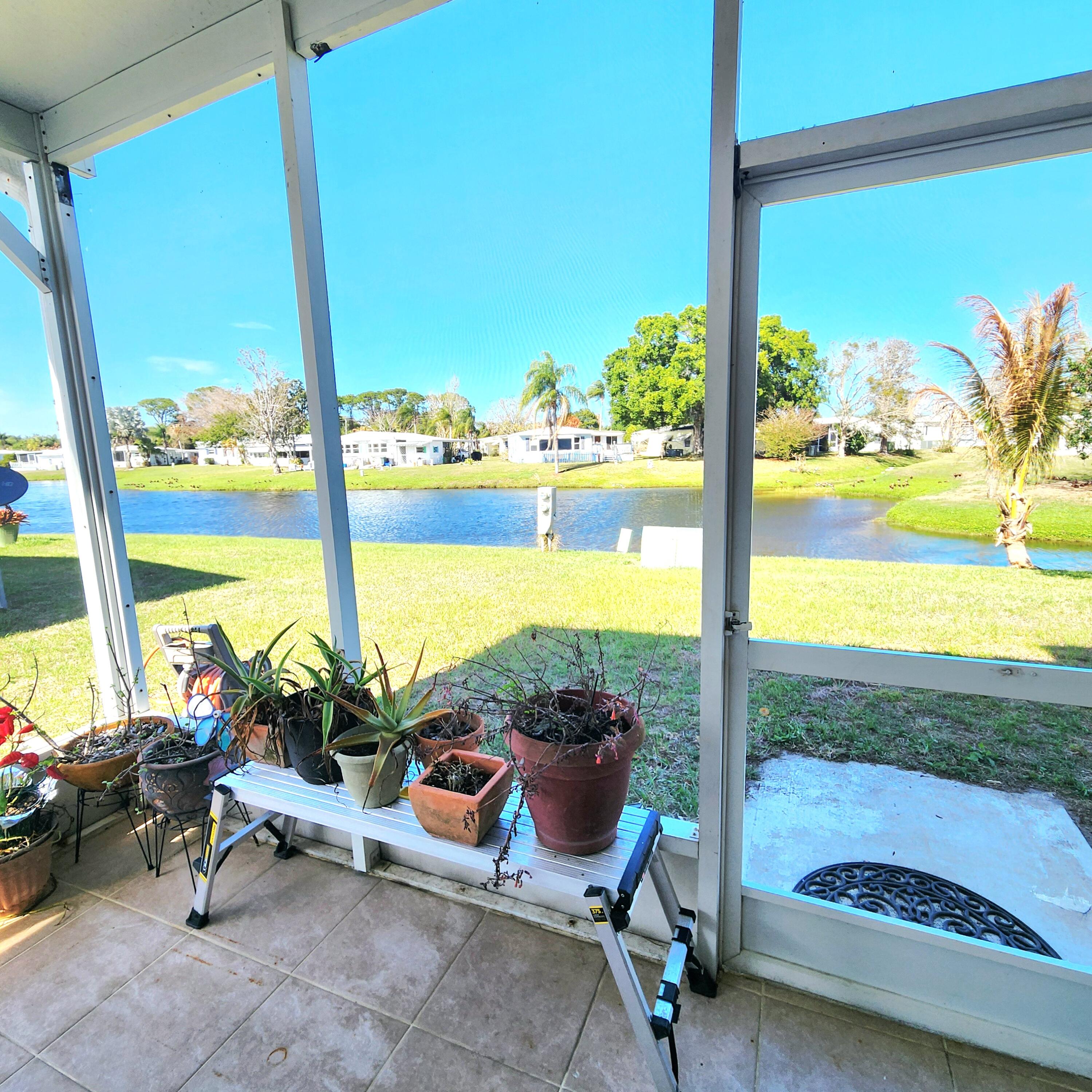 98 Camino Del Rio Port St. Lucie, FL 34952 - Photo 45 of 60 a view of a floor to ceiling window and wooden floor