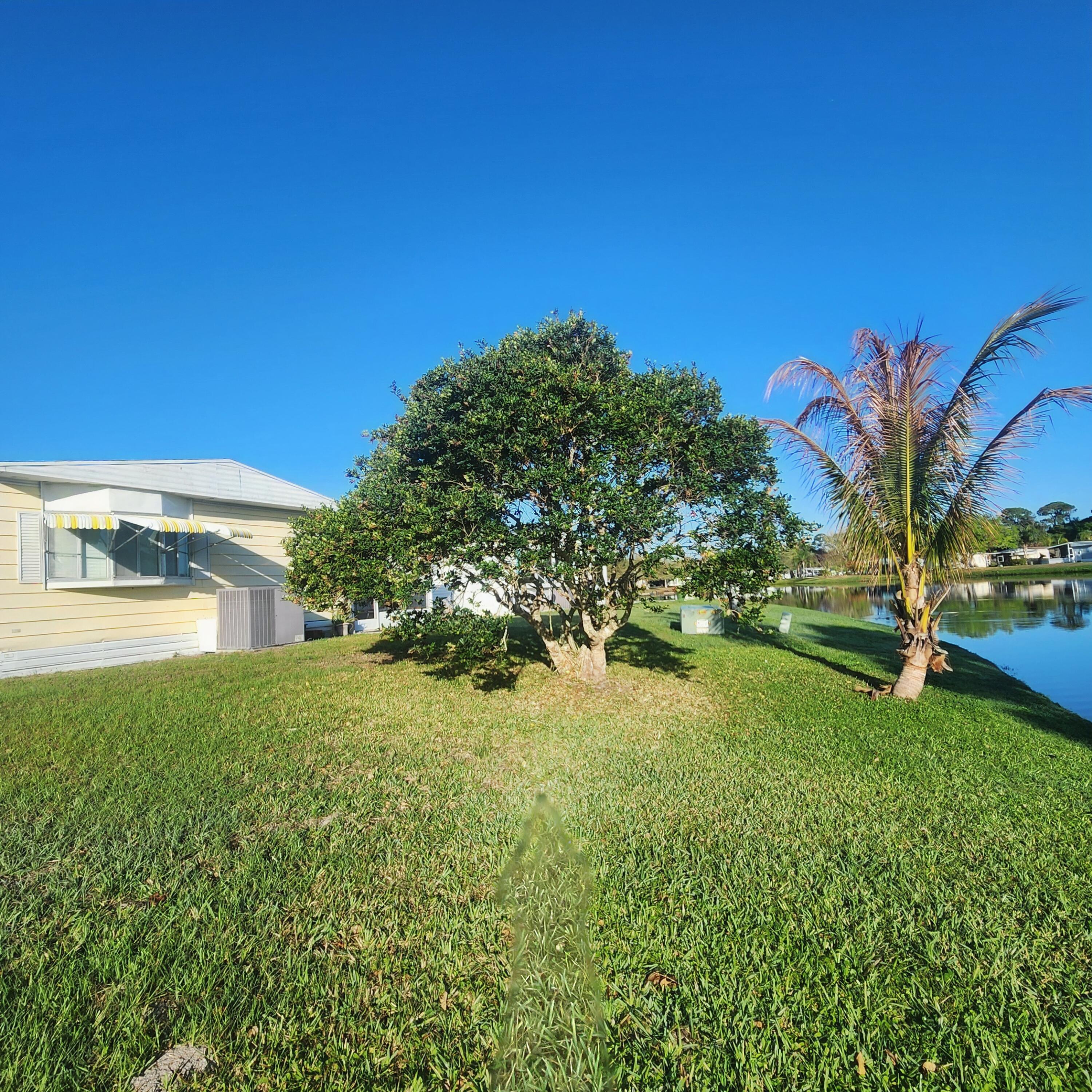 98 Camino Del Rio Port St. Lucie, FL 34952 - Photo 46 of 60 a view of a yard in front of house