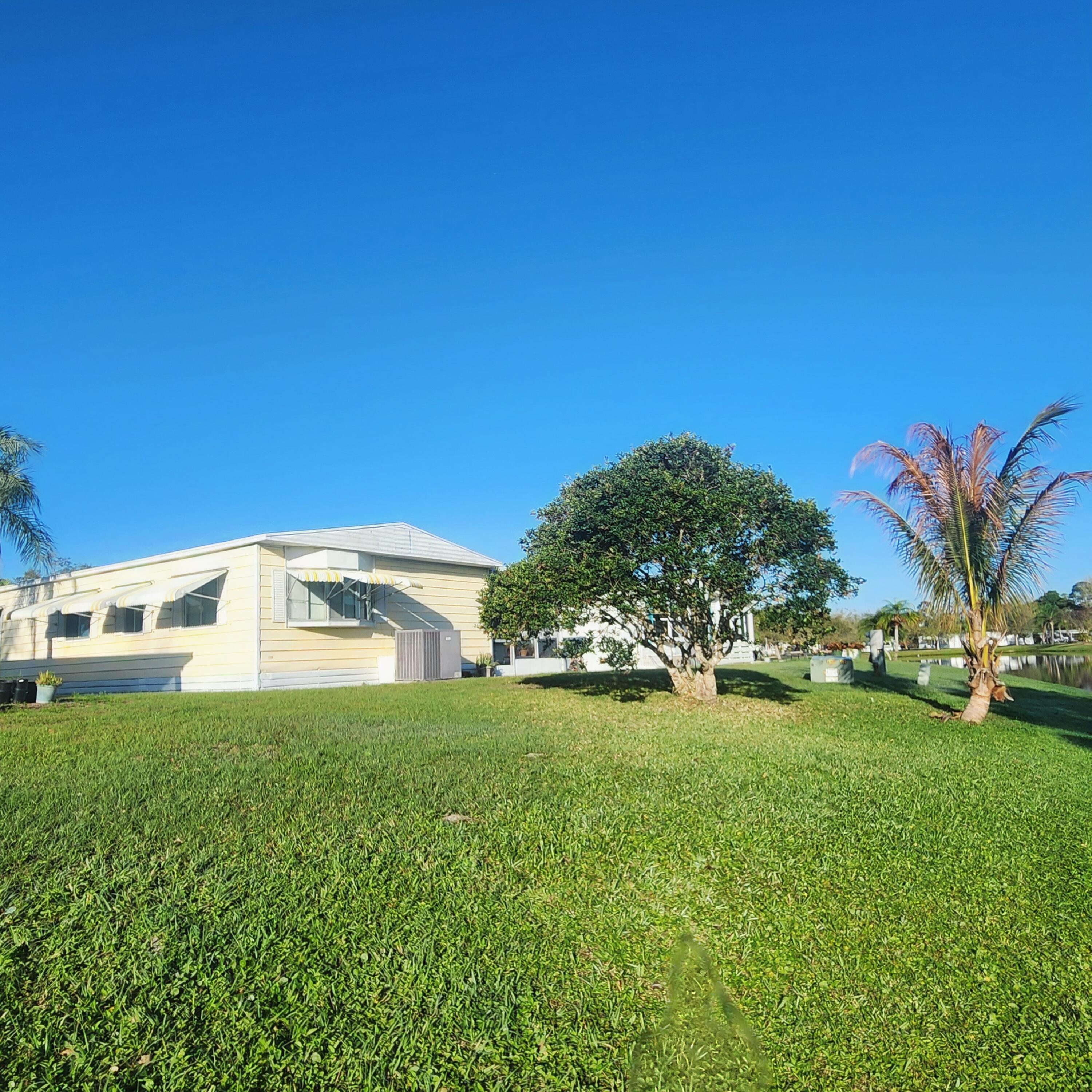 98 Camino Del Rio Port St. Lucie, FL 34952 - Photo 53 of 60 a view of a house with a big yard