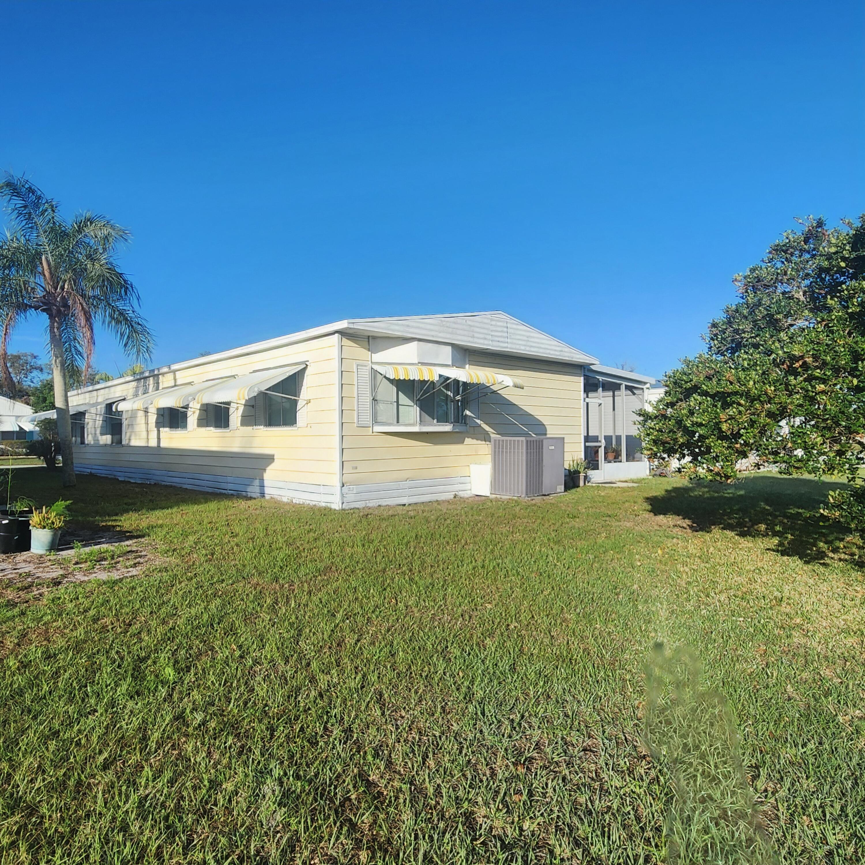 98 Camino Del Rio Port St. Lucie, FL 34952 - Photo 54 of 60 a house view with a outdoor space