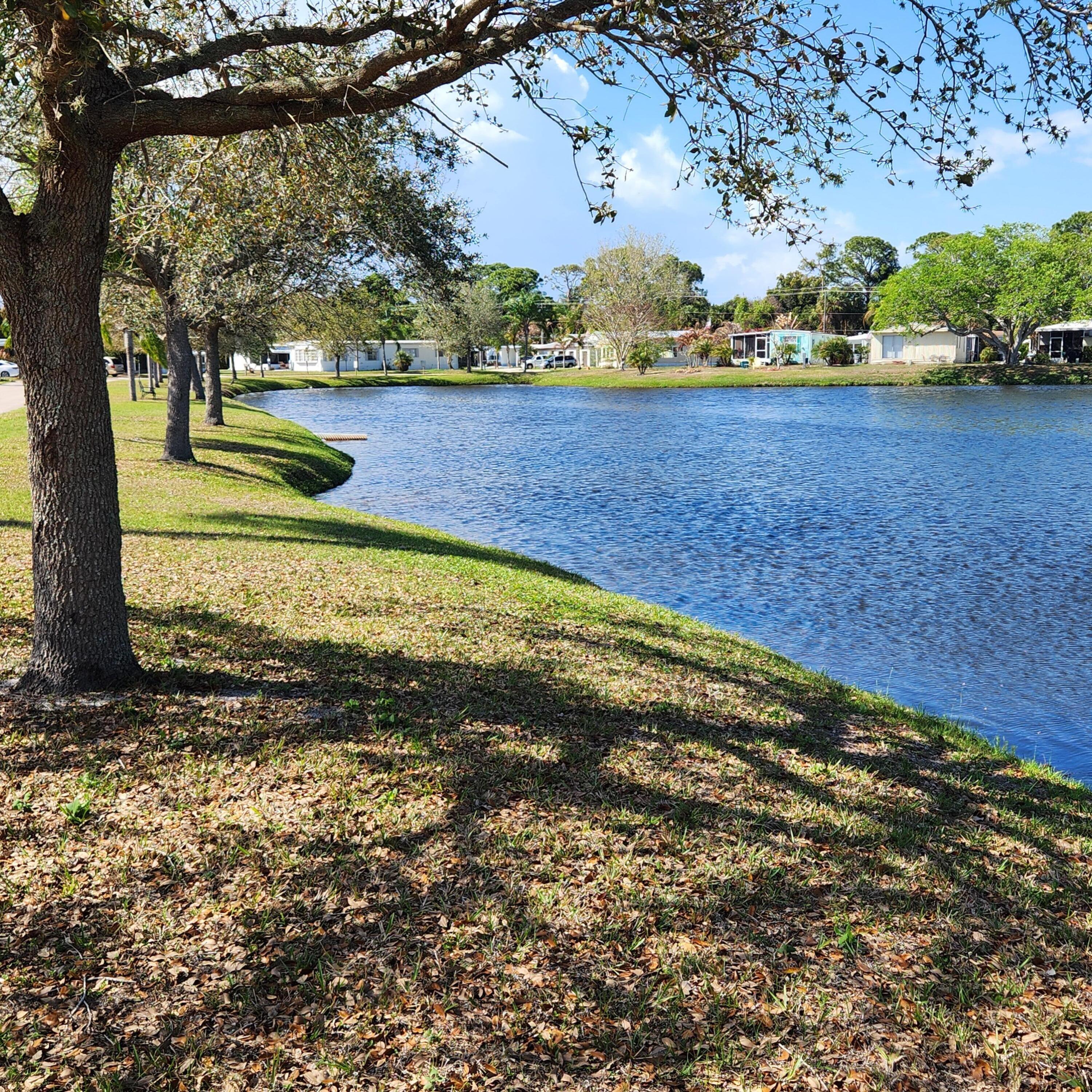 98 Camino Del Rio Port St. Lucie, FL 34952 - Photo 57 of 60 a view of a yard with an outdoor space