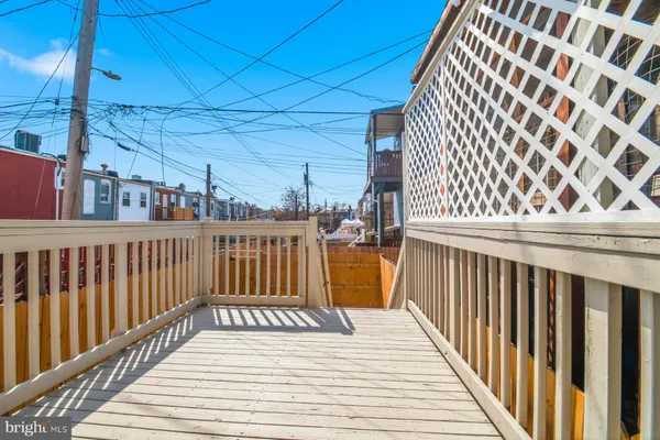 a view of a balcony with wooden floor