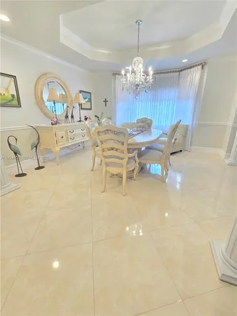 a spacious bathroom with a sink and a mirror