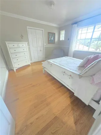 a dining room with furniture and a chandelier
