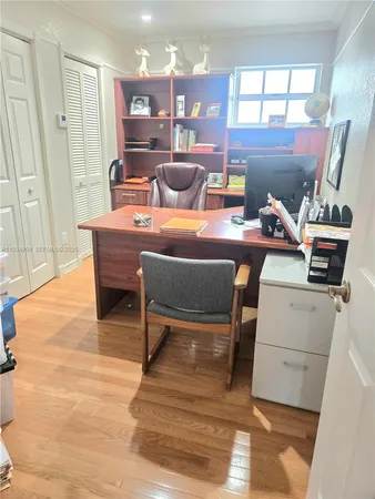 a backyard of a house with lots of green space and lake view