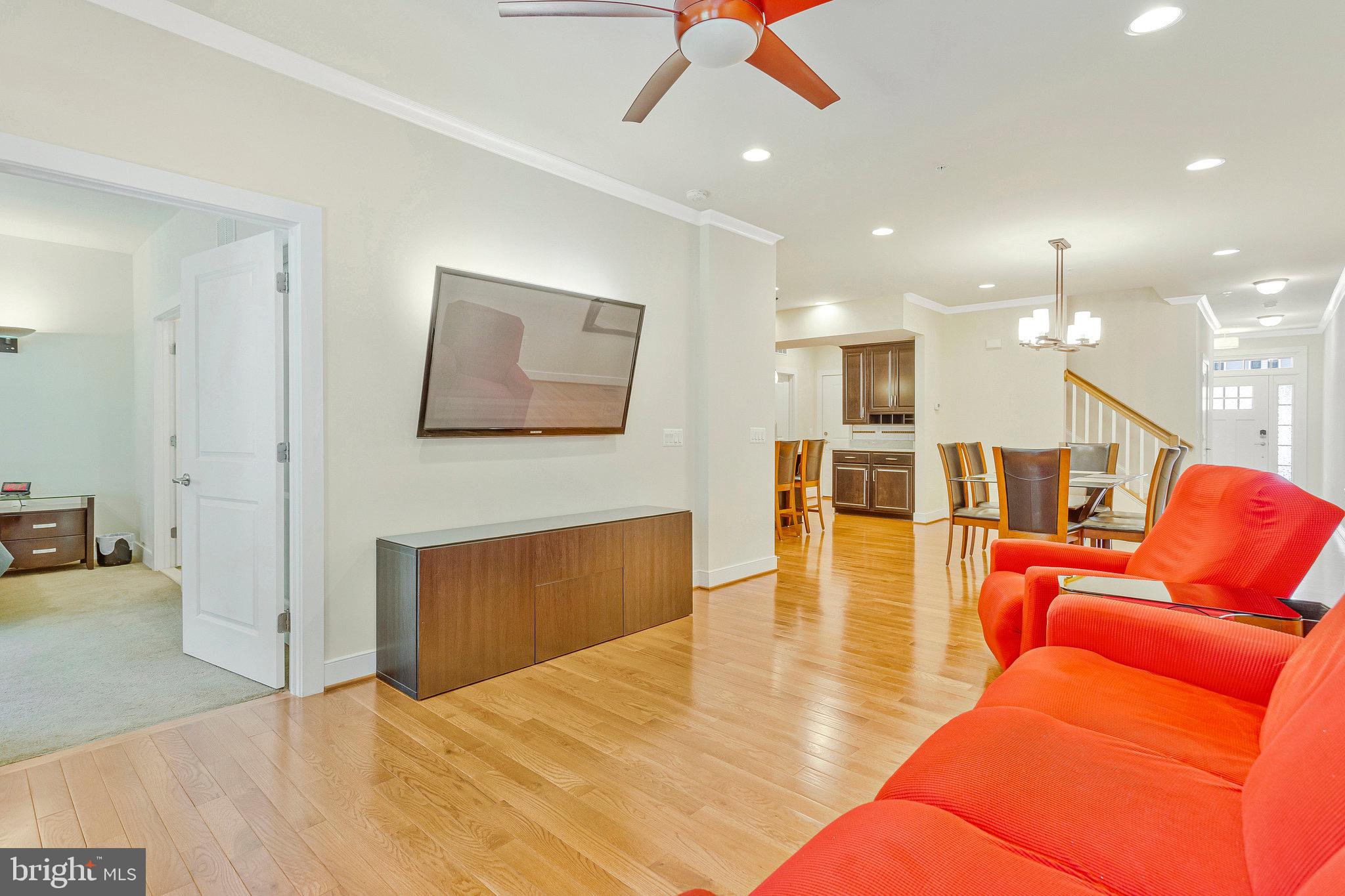 9726 Knowledge Drive Laurel, MD 20723 - Photo 12 of 54 a living room with furniture and a wooden floor