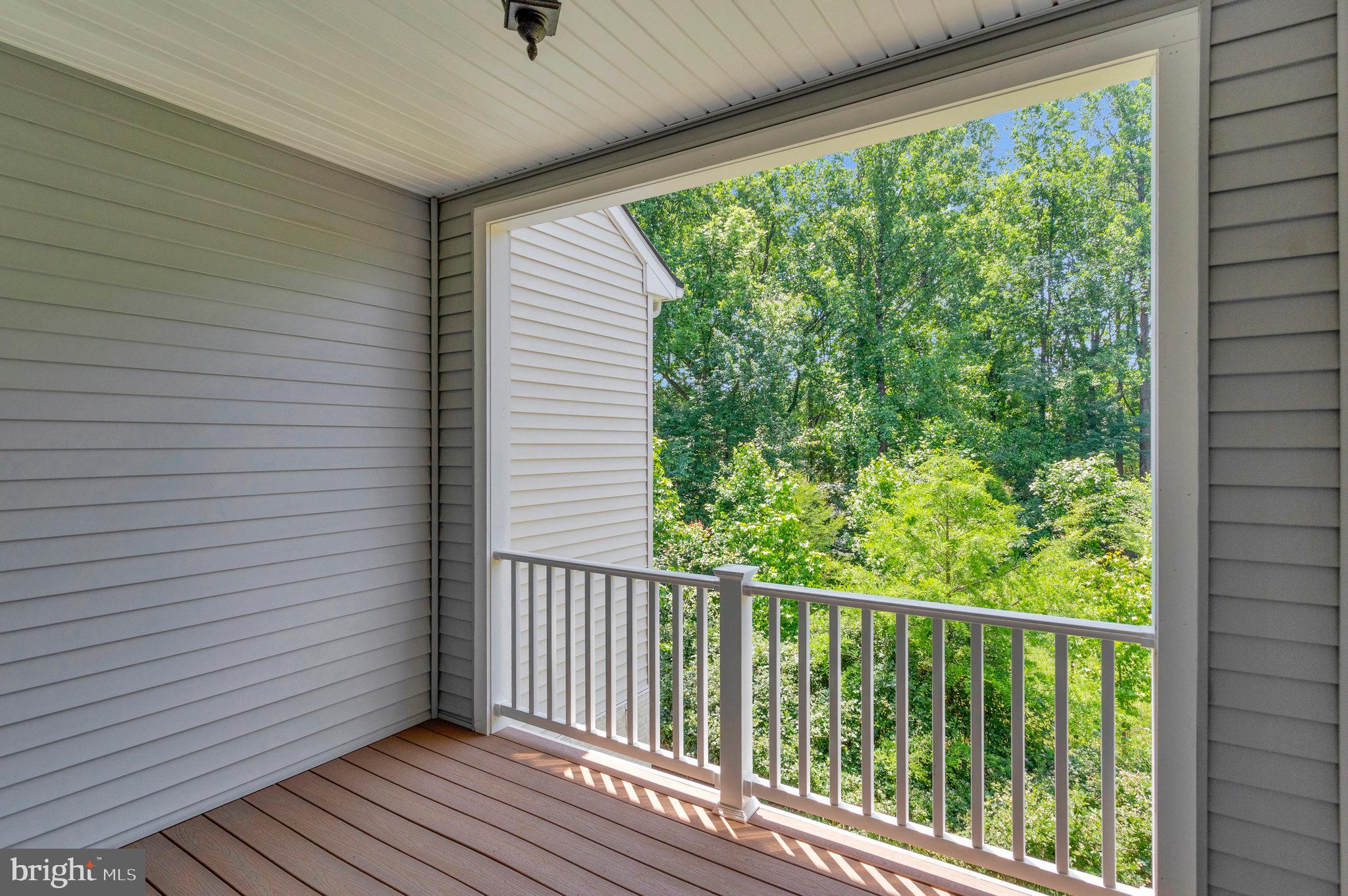 9726 Knowledge Drive Laurel, MD 20723 - Photo 13 of 54 a view of a balcony with wooden floor