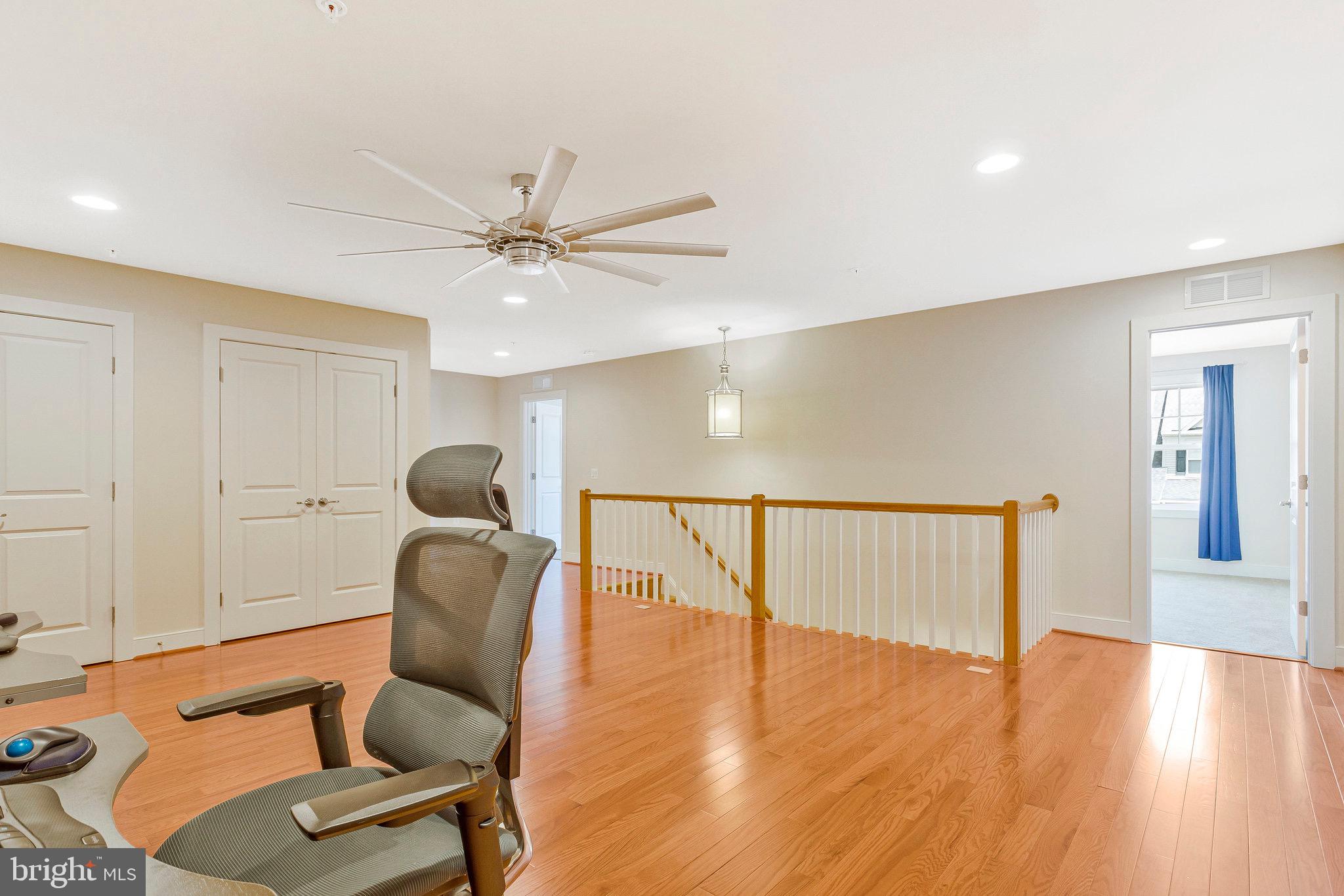 9726 Knowledge Drive Laurel, MD 20723 - Photo 29 of 54 a view of a livingroom with furniture and wooden floor