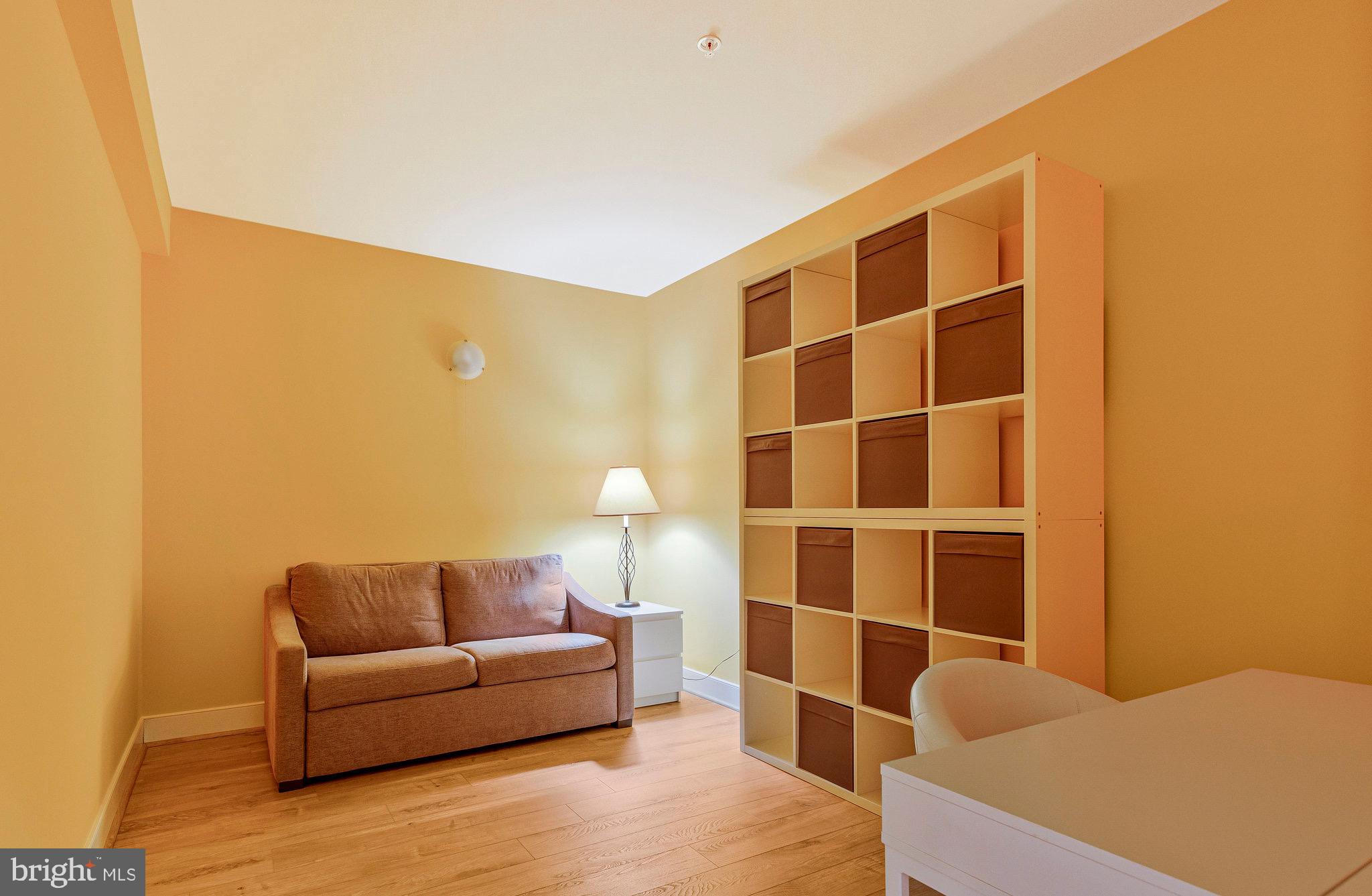 9726 Knowledge Drive Laurel, MD 20723 - Photo 35 of 54 a living room with furniture a rug and a window