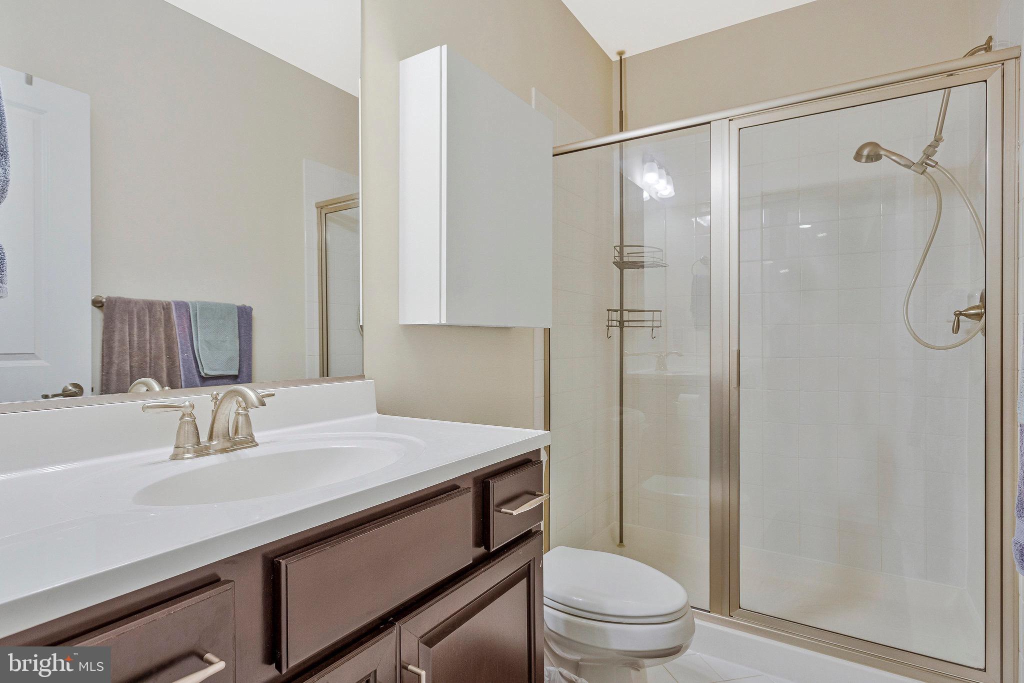 9726 Knowledge Drive Laurel, MD 20723 - Photo 39 of 54 a bathroom with a sink toilet and shower