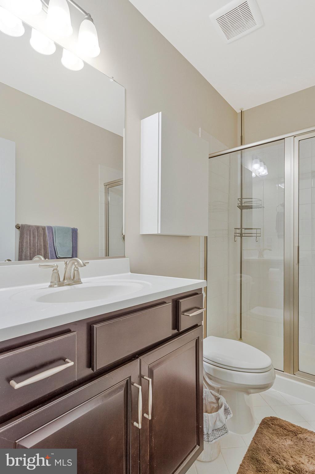 9726 Knowledge Drive Laurel, MD 20723 - Photo 40 of 54 a bathroom with a sink a toilet and shower