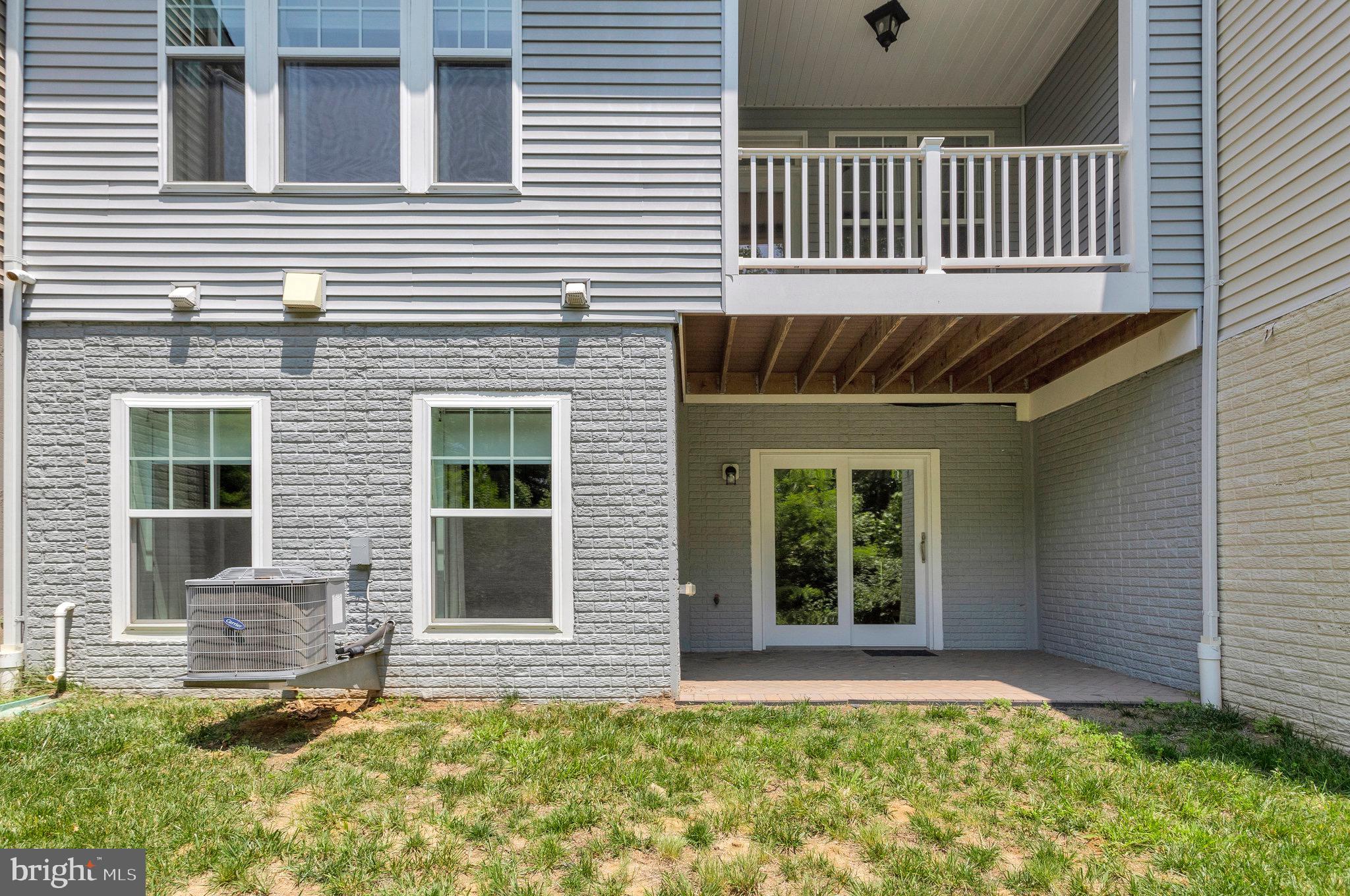 9726 Knowledge Drive Laurel, MD 20723 - Photo 48 of 54 front view of a house with a large window