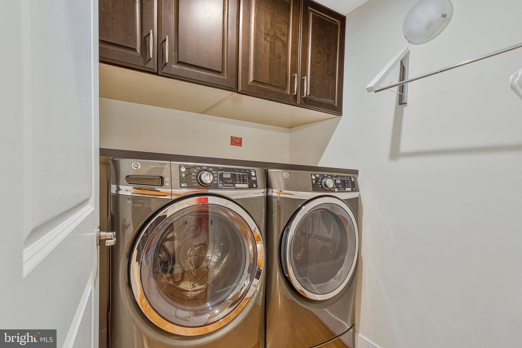 9726 Knowledge Drive Laurel, MD 20723 - Photo 10 of 54 a utility room with dryer and washer