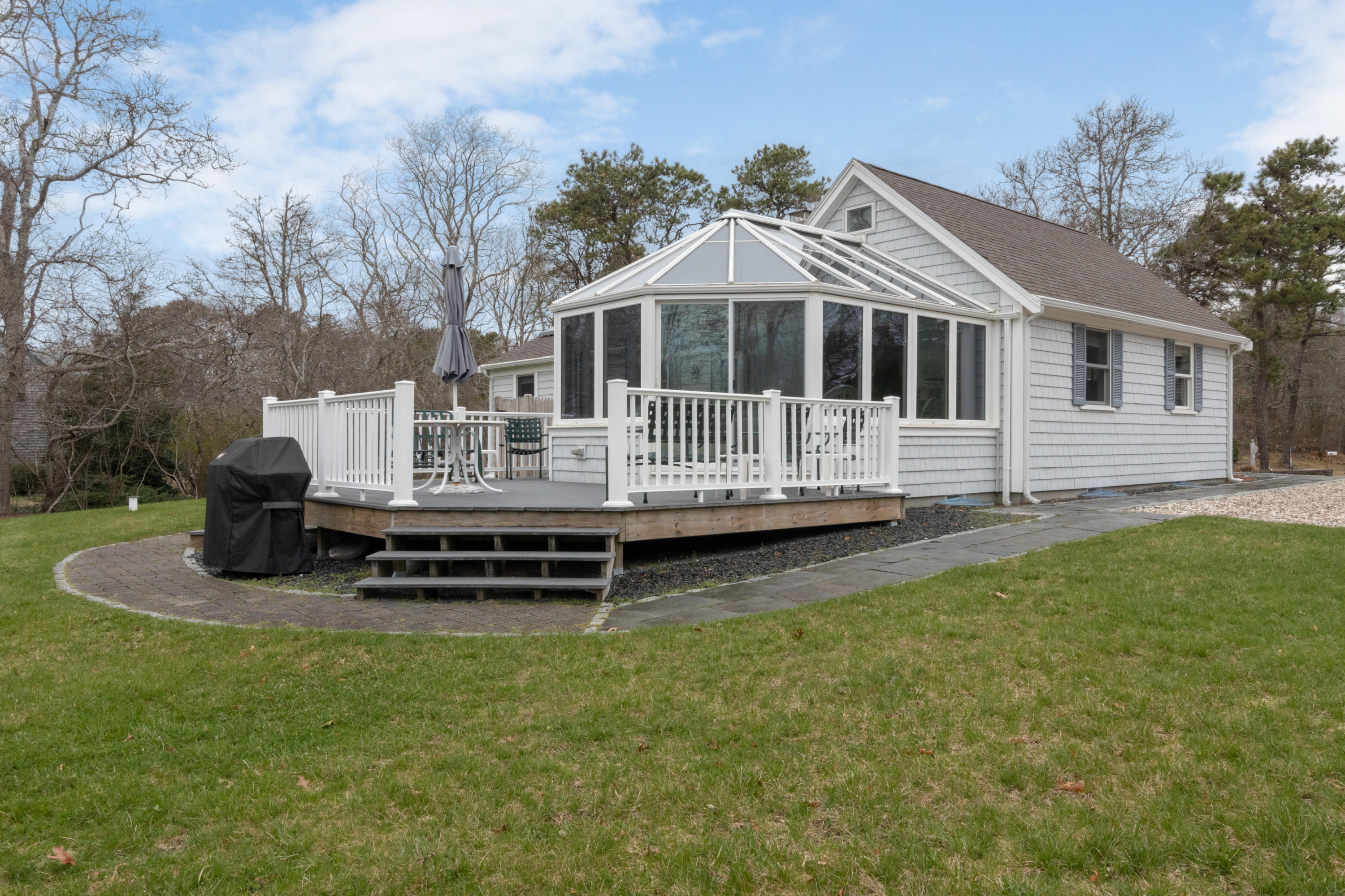 525 Locust Road Eastham, MA 02642 - Photo 4 of 21 a front view of a house with a yard