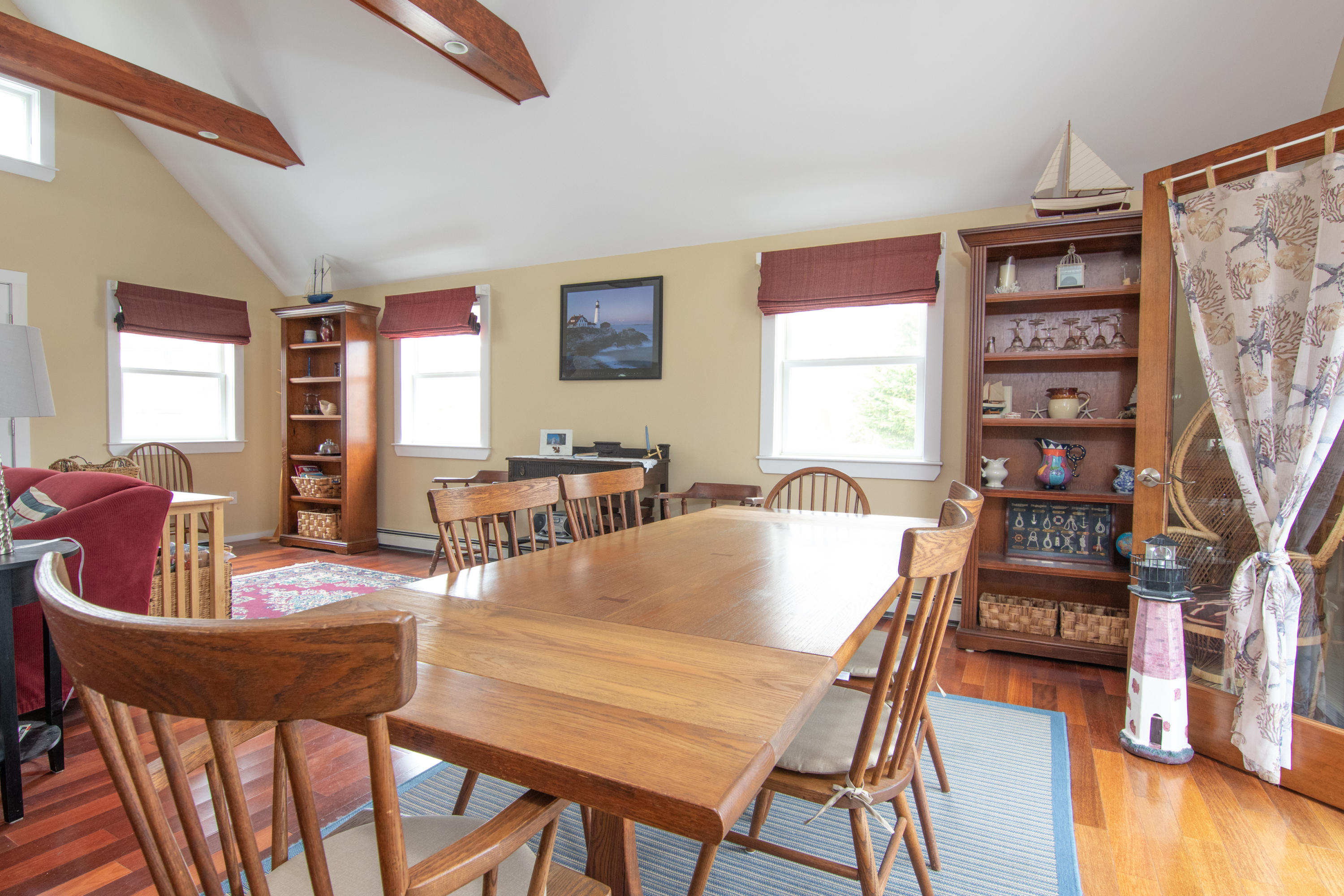 525 Locust Road Eastham, MA 02642 - Photo 9 of 21 a view of a dining room with furniture and wooden floor