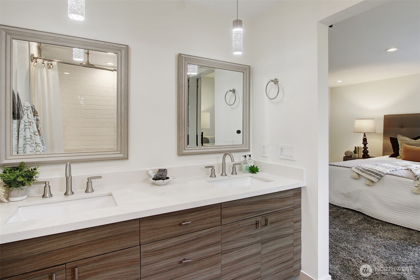 1230 222nd Place Southwest Bothell, WA 98021 - Photo 19 of 28 a en suite bathroom with double vanity sinks and a mirror