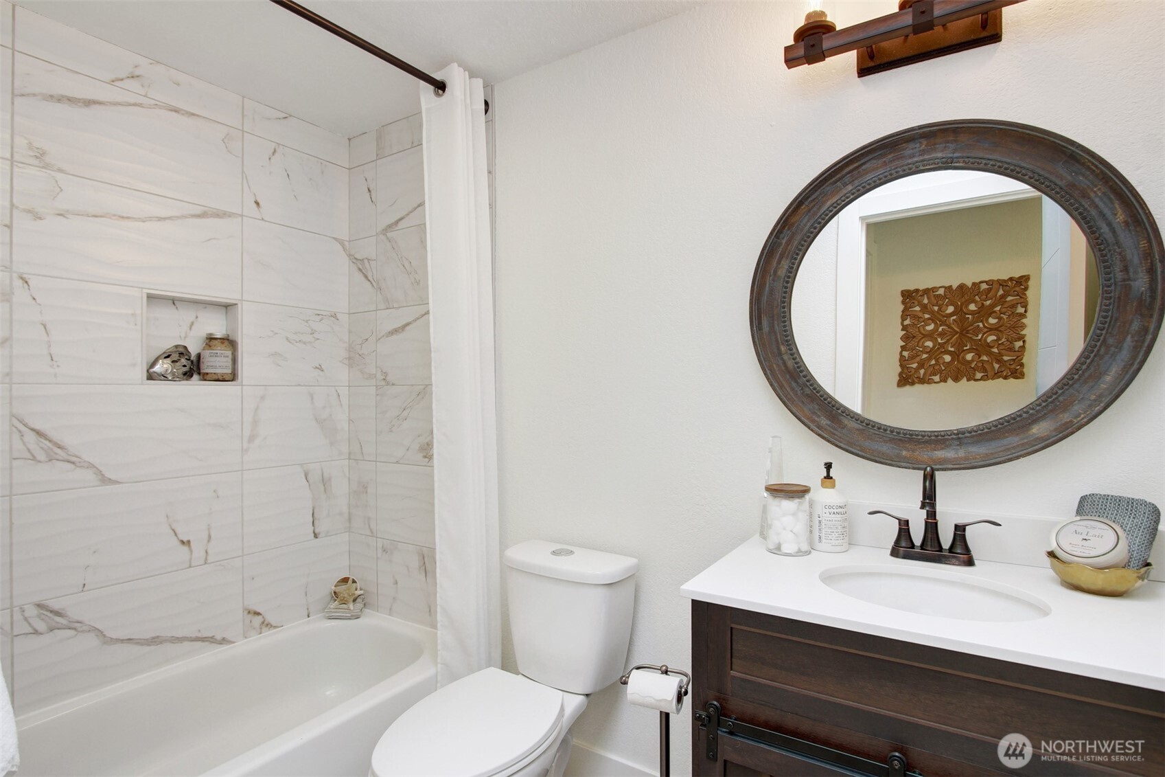 1230 222nd Place Southwest Bothell, WA 98021 - Photo 22 of 28 a bathroom with a sink a toilet and a mirror