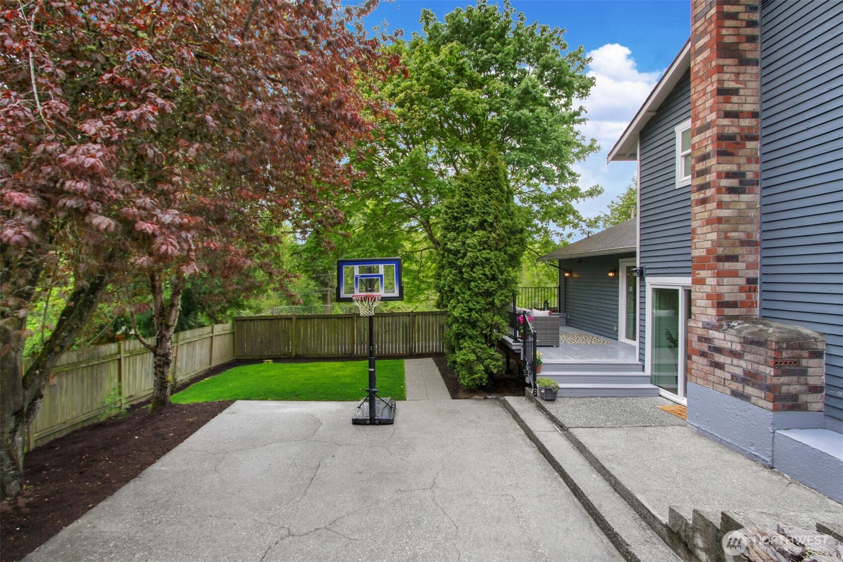 1230 222nd Place Southwest Bothell, WA 98021 - Photo 24 of 28 a front view of a house with a yard and garage