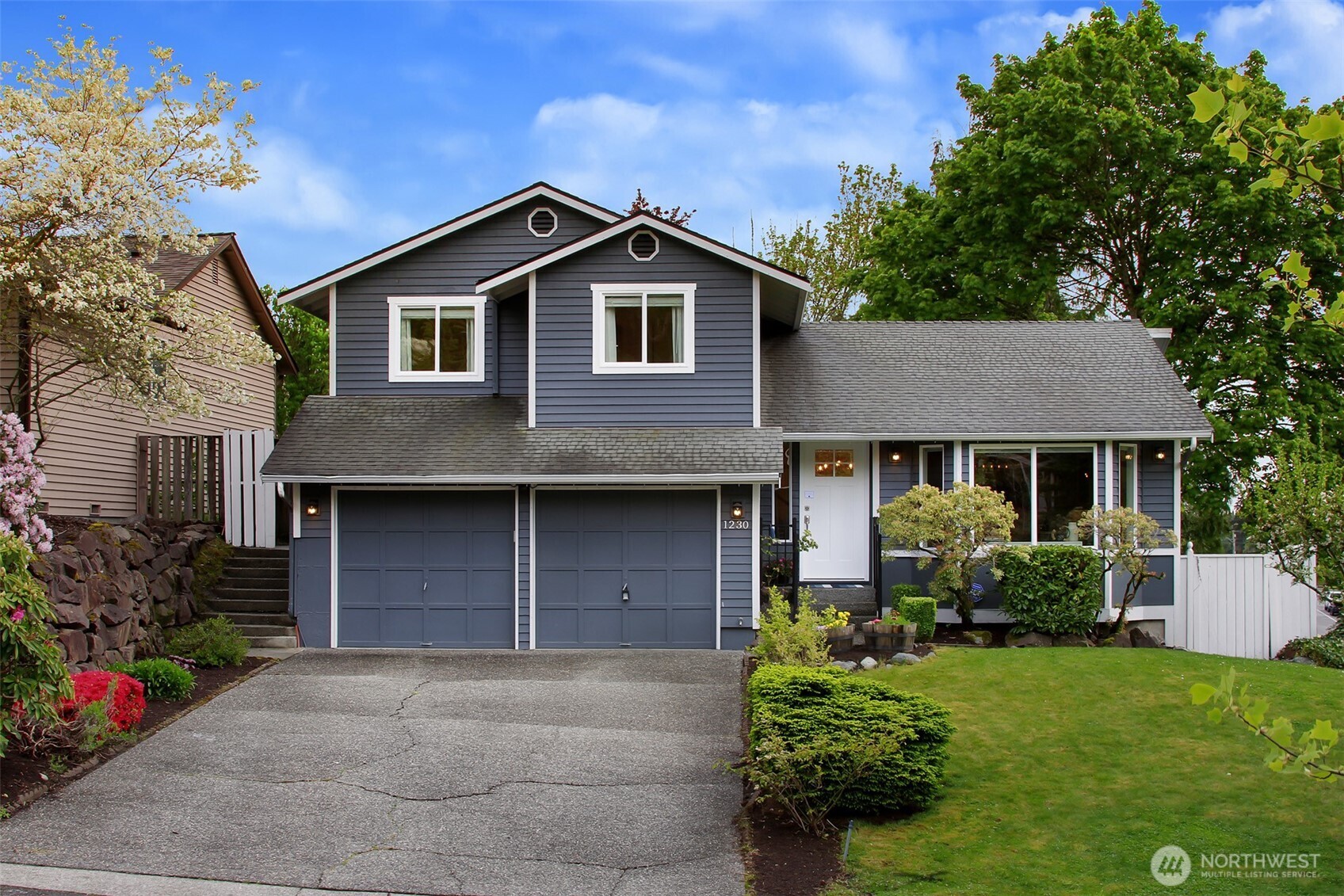 1230 222nd Place Southwest Bothell, WA 98021 - Photo 27 of 28 front view of a house with a yard