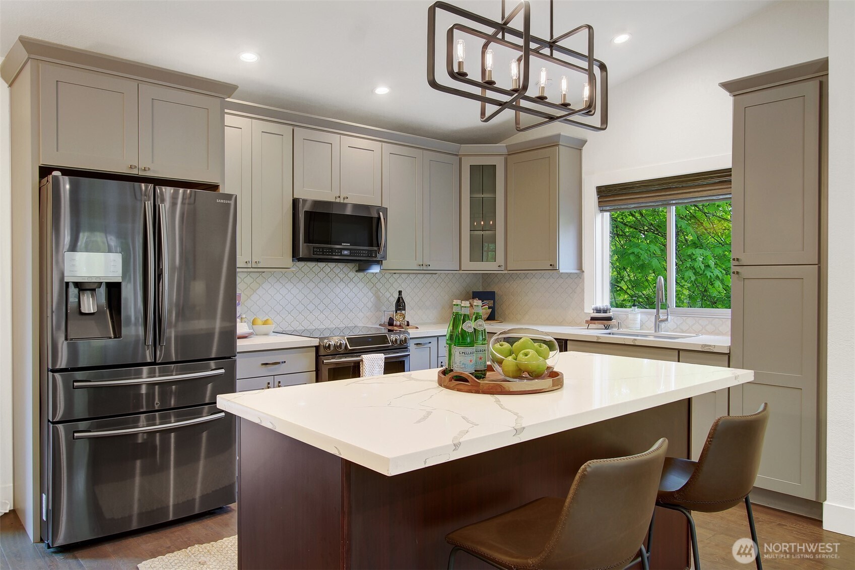 1230 222nd Place Southwest Bothell, WA 98021 - Photo 10 of 28 a kitchen with stainless steel appliances granite countertop a sink refrigerator and microwave