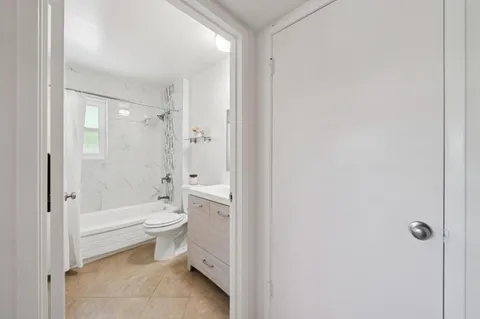 a bathroom with a toilet a sink and bathtub