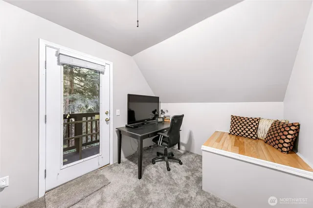 a view of balcony with wooden floor