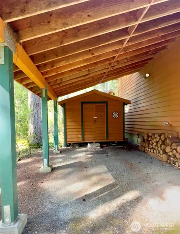 a view of a house with a yard patio and fire pit
