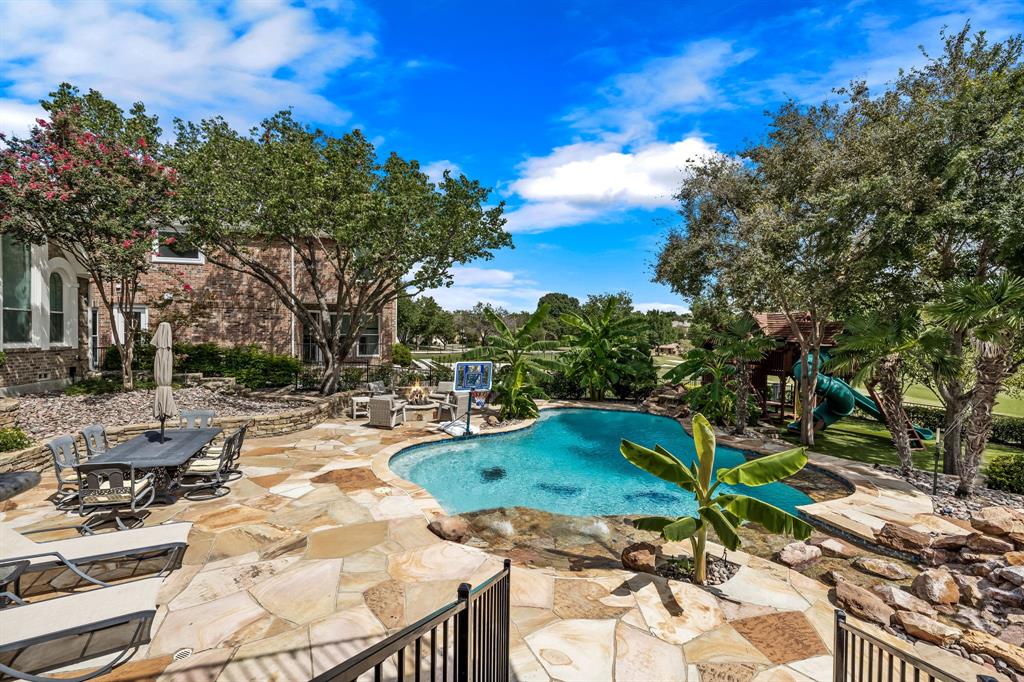 7532 Bradford Pear Drive Irving, TX 75063 - Photo 1 of 1 a view of backyard with swimming pool and outdoor seating