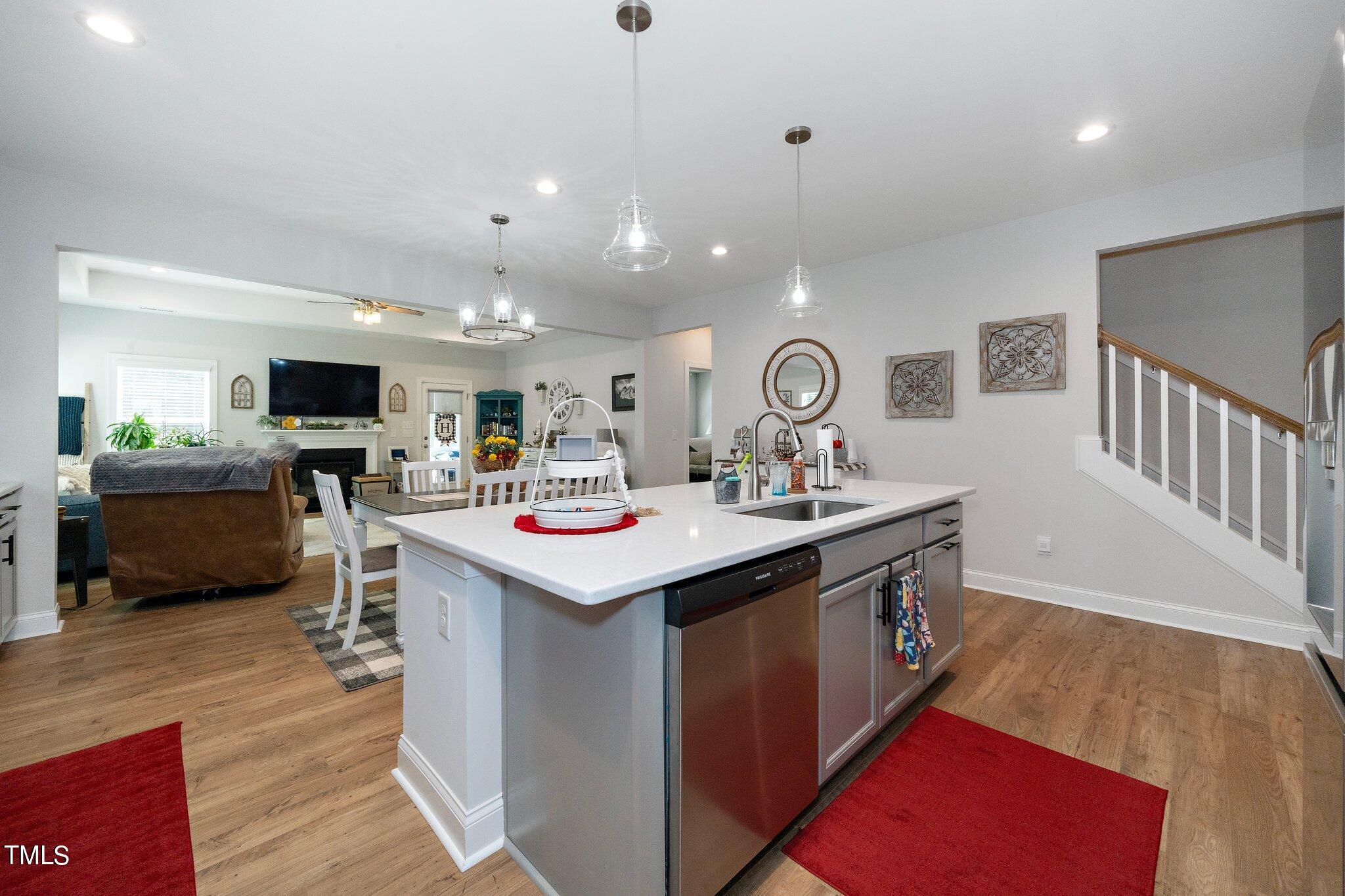 204 Stephens Timberline View Clayton, NC 27520 - Photo 12 of 43 a kitchen with a sink stainless steel appliances and view living room