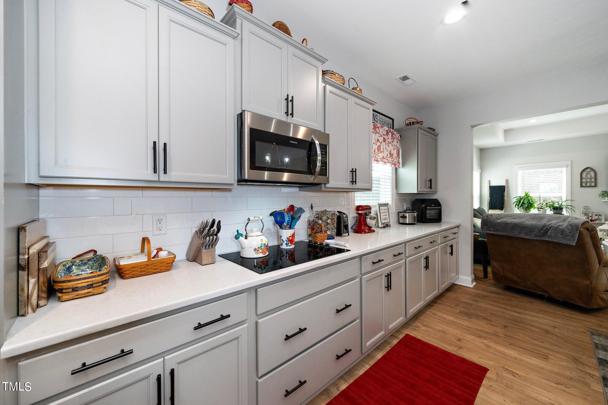 204 Stephens Timberline View Clayton, NC 27520 - Photo 13 of 43 a kitchen with cabinets a sink and appliances