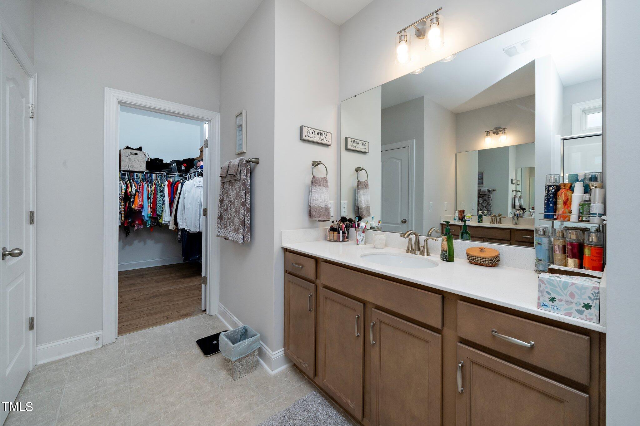 204 Stephens Timberline View Clayton, NC 27520 - Photo 20 of 43 a en suite bathroom with a sink and mirror