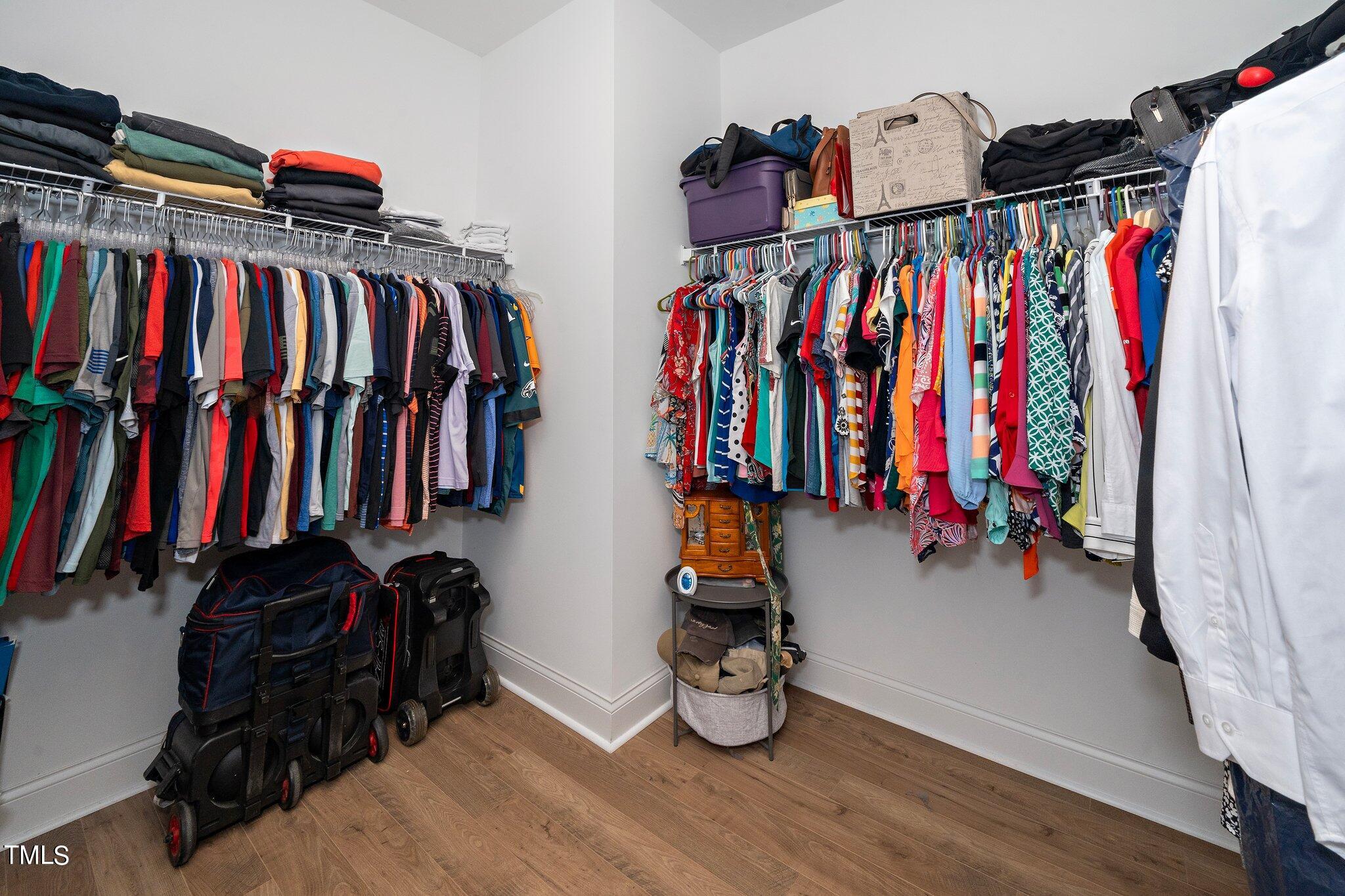 204 Stephens Timberline View Clayton, NC 27520 - Photo 22 of 43 a view of walk in closet with clothes and shoes