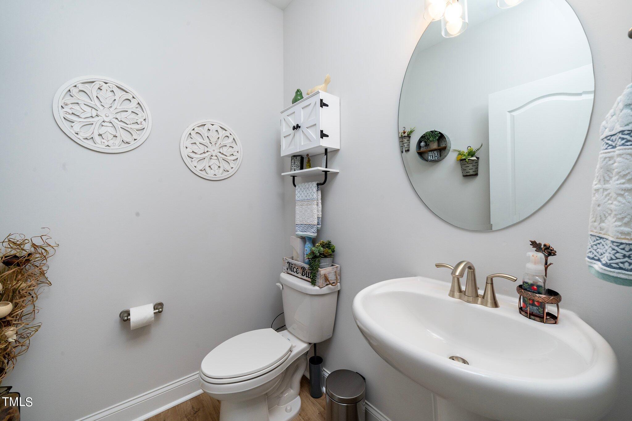 204 Stephens Timberline View Clayton, NC 27520 - Photo 23 of 43 a bathroom with a sink mirror and toilet