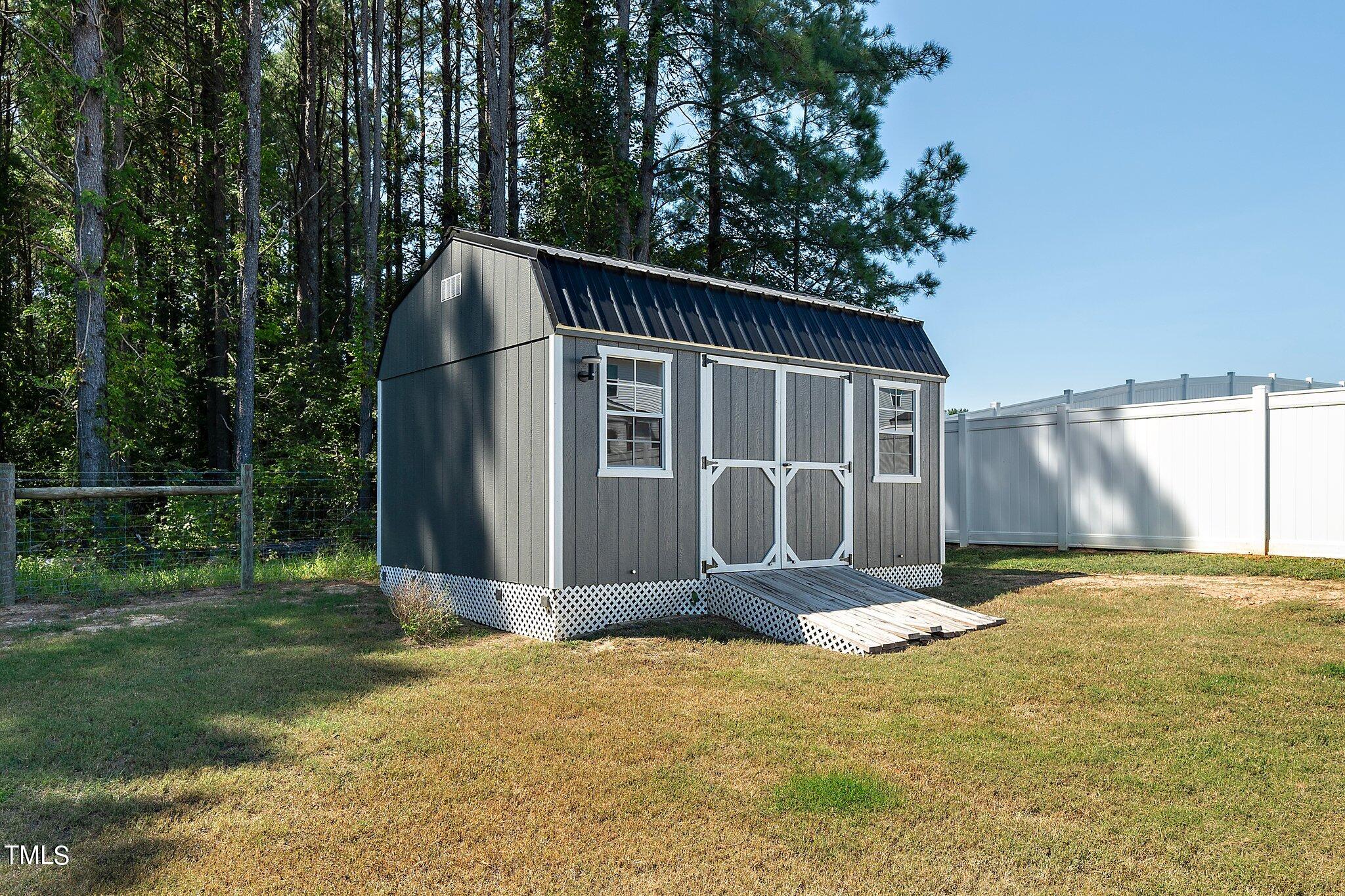 204 Stephens Timberline View Clayton, NC 27520 - Photo 39 of 43 a front view of a house with garden
