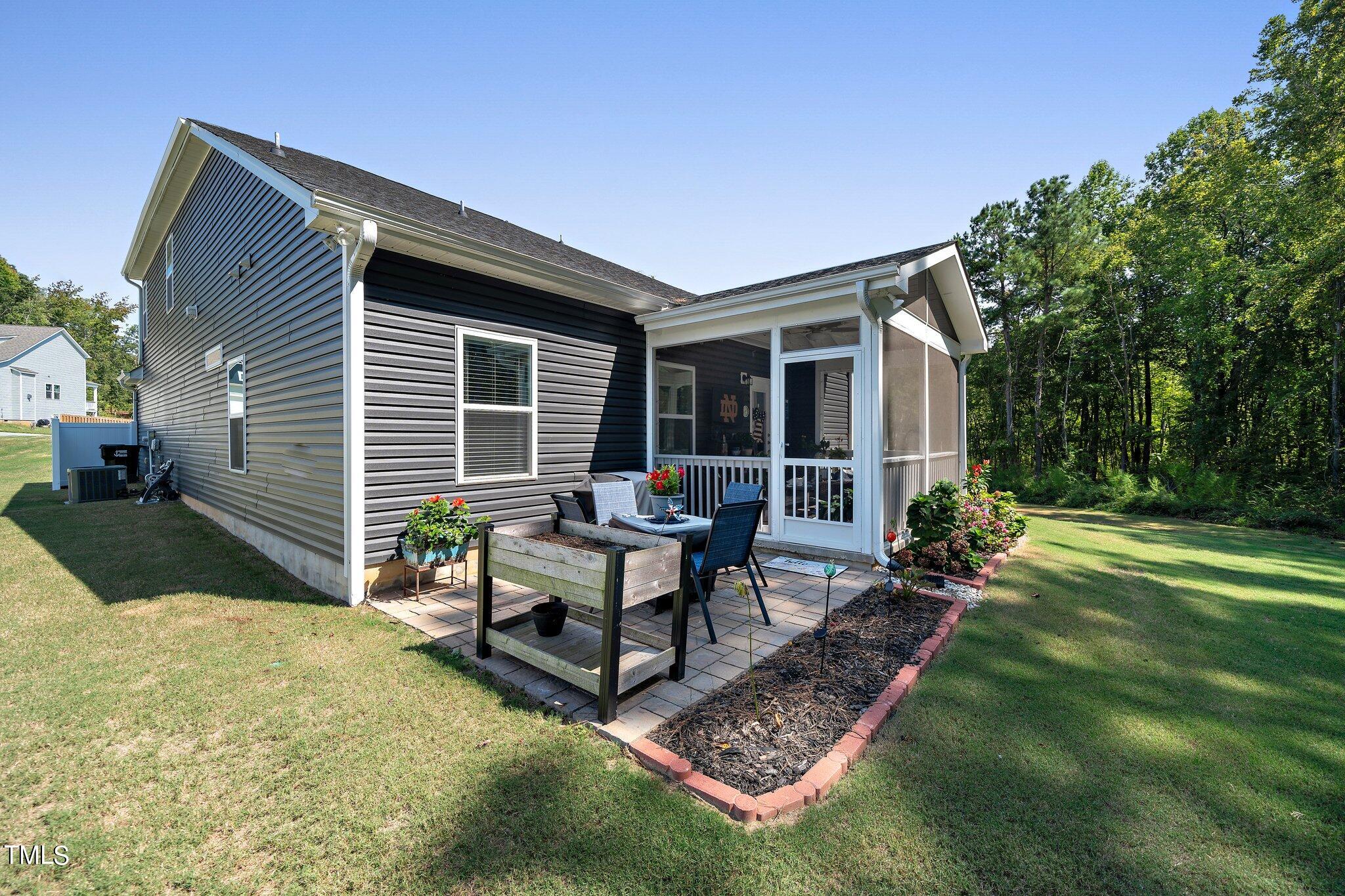 204 Stephens Timberline View Clayton, NC 27520 - Photo 41 of 43 a view of a house with backyard and sitting area