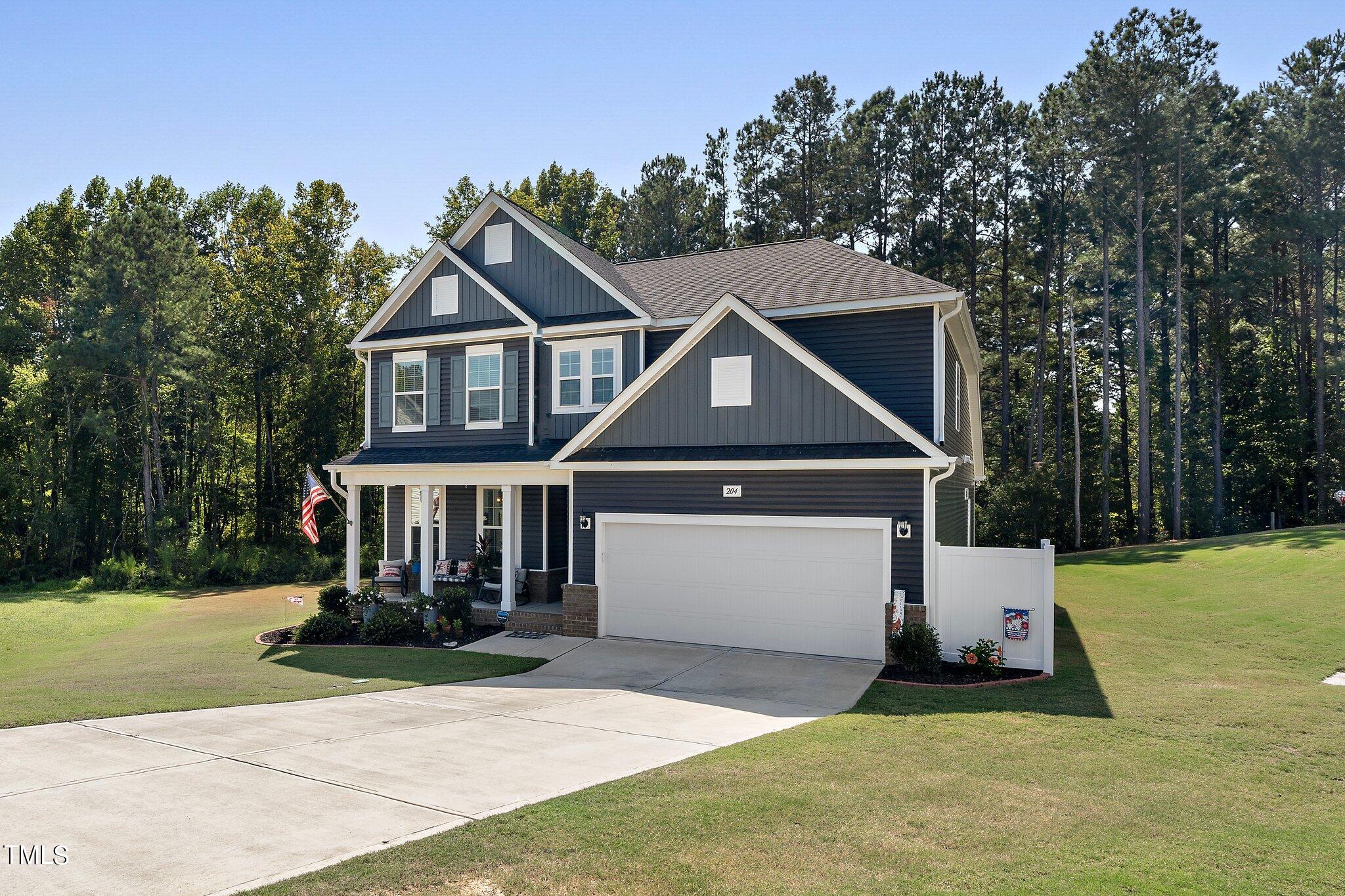 204 Stephens Timberline View Clayton, NC 27520 - Photo 43 of 43 a front view of a house with a yard