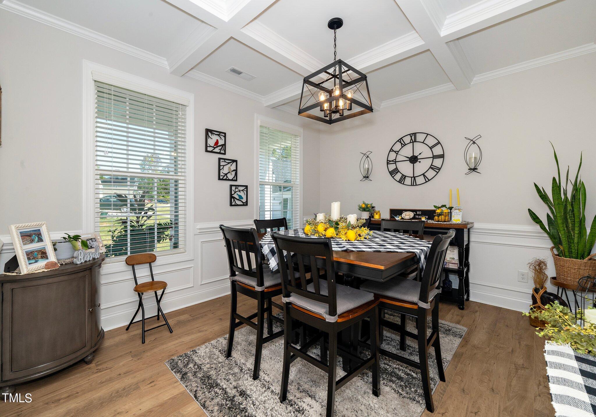 204 Stephens Timberline View Clayton, NC 27520 - Photo 5 of 43 a view of a dining room with furniture a chandelier and wooden floor