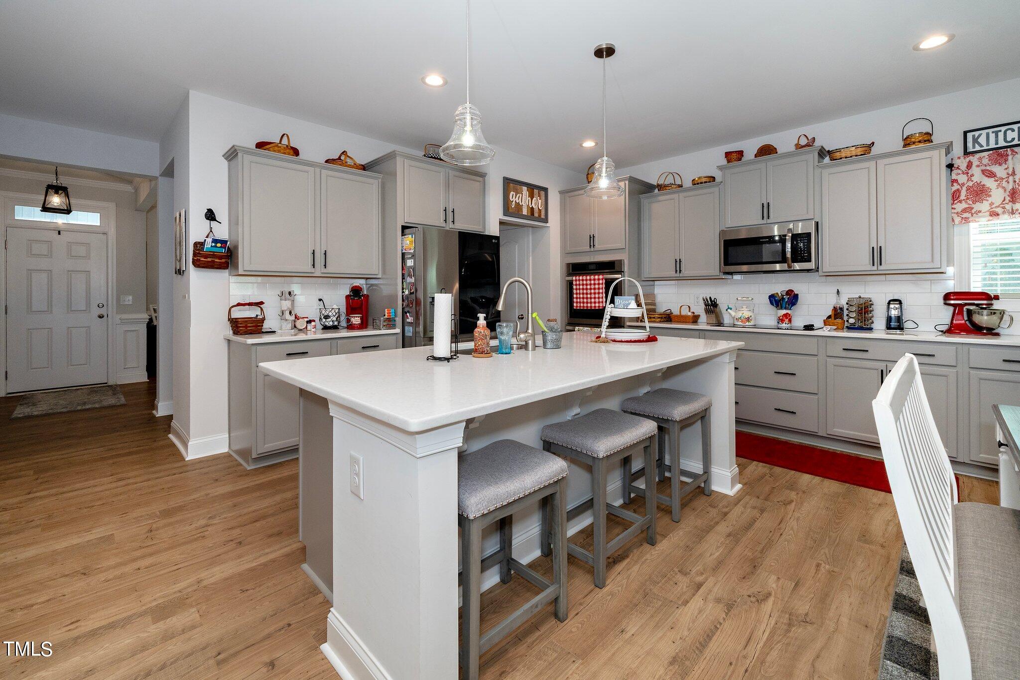 204 Stephens Timberline View Clayton, NC 27520 - Photo 8 of 43 a kitchen with a sink cabinets and wooden floor