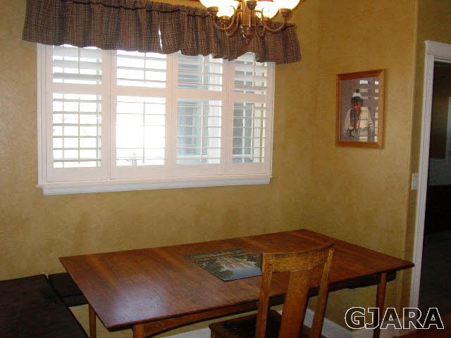 2502 Riata Ranch Road Grand Junction, CO 81505 - Photo 19 of 31 a view of a room that has a bed and a window