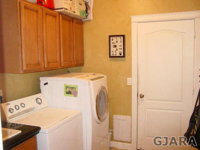 2502 Riata Ranch Road Grand Junction, CO 81505 - Photo 25 of 31 a utility room with dryer and washer