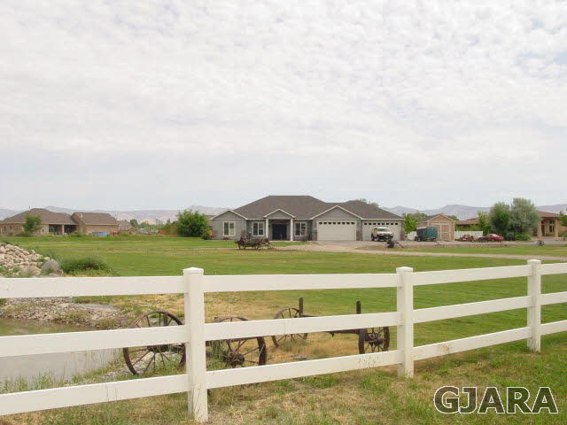 2502 Riata Ranch Road Grand Junction, CO 81505 - Photo 31 of 31 a front view of a house with a yard