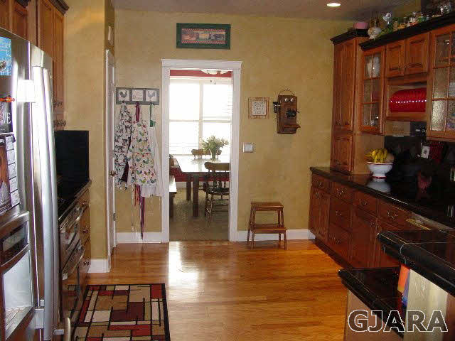 2502 Riata Ranch Road Grand Junction, CO 81505 - Photo 8 of 31 a view of a dining room with furniture window and wooden floor
