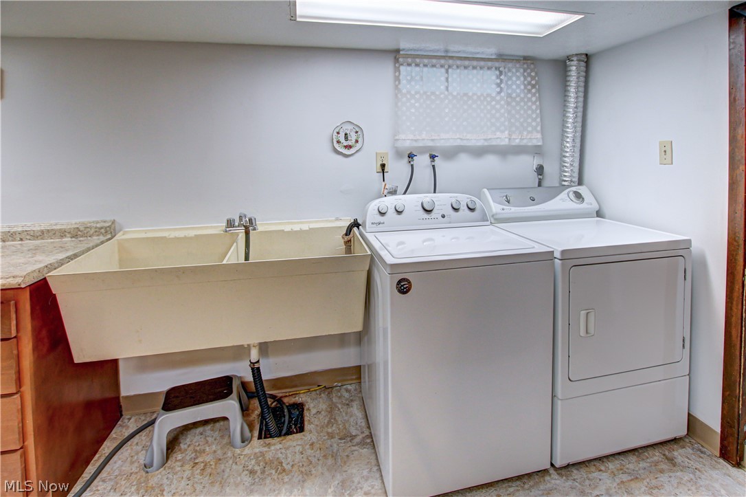 6013 Rousseau Drive Parma, OH 44129 - Photo 35 of 50 Lower level laundry area with washer and dryer, hookup for an electric dryer, and washer hookup