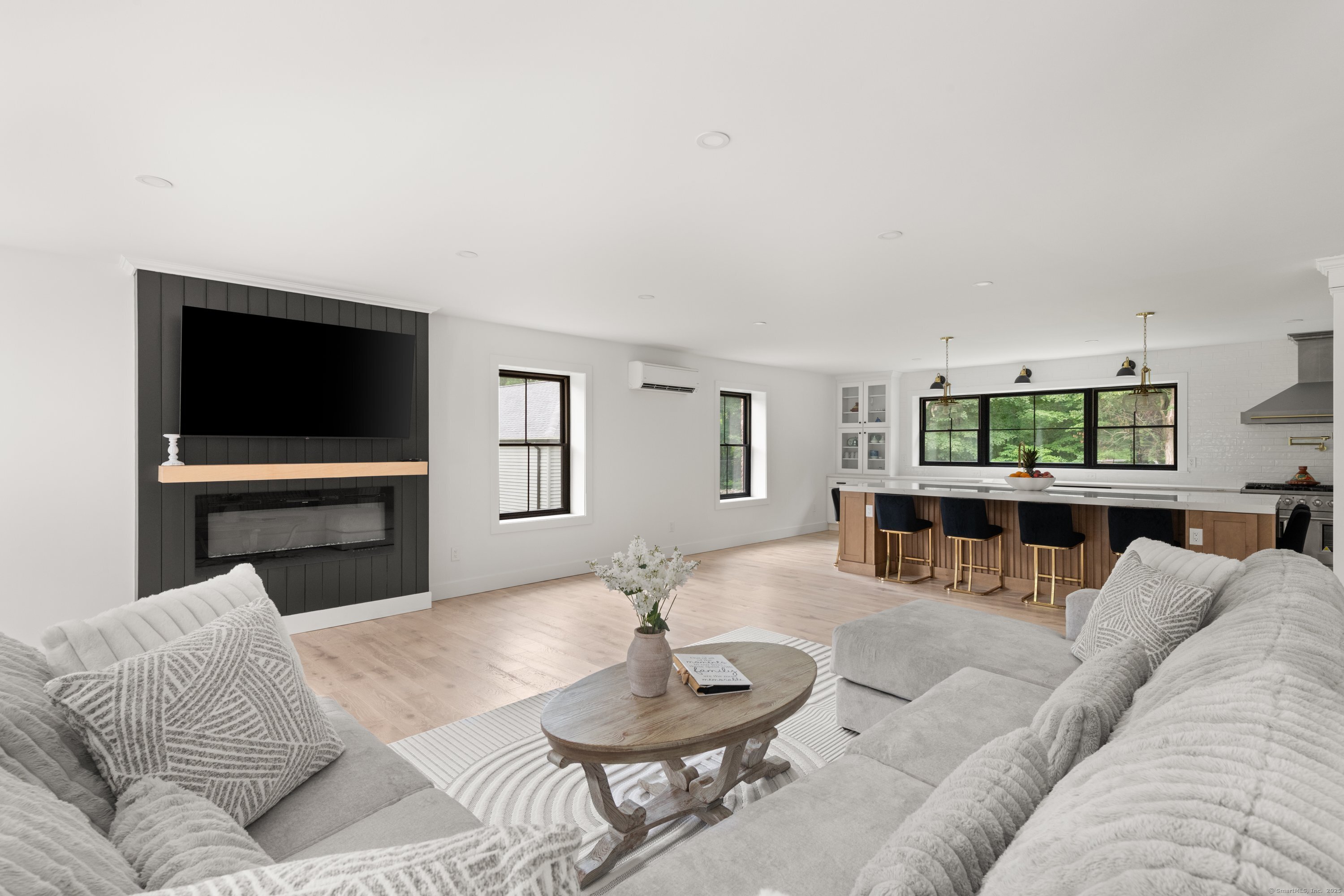 372 Tucker Hill Road Middlebury, CT 06762 - Photo 20 of 33 a living room with furniture and a flat screen tv