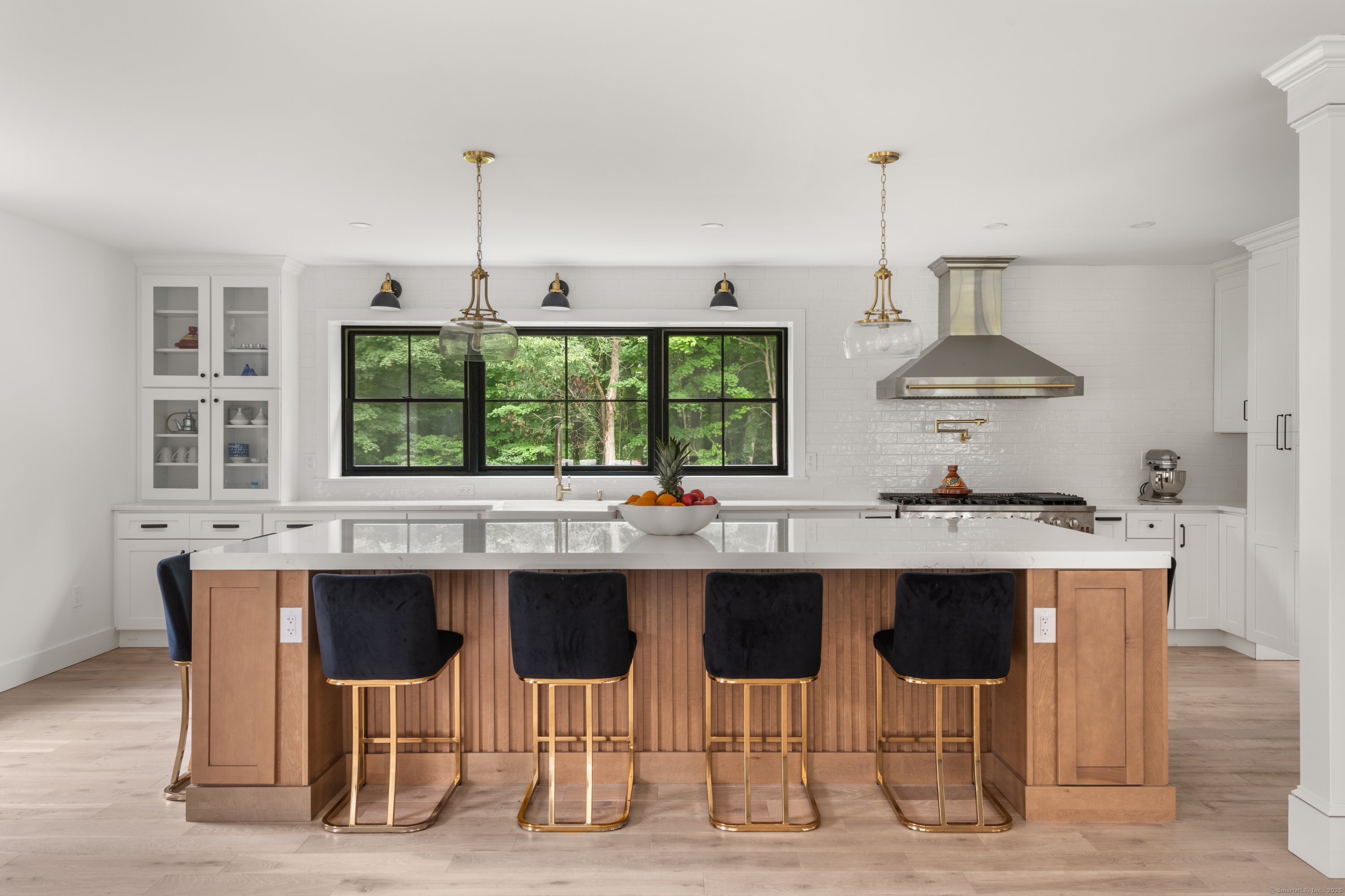 372 Tucker Hill Road Middlebury, CT 06762 - Photo 25 of 33 a kitchen with a sink and chairs
